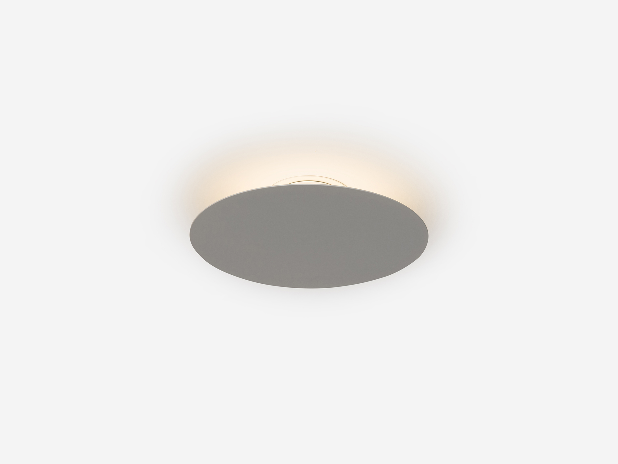 Side view of Klein white ceiling lighting fixture with light on
