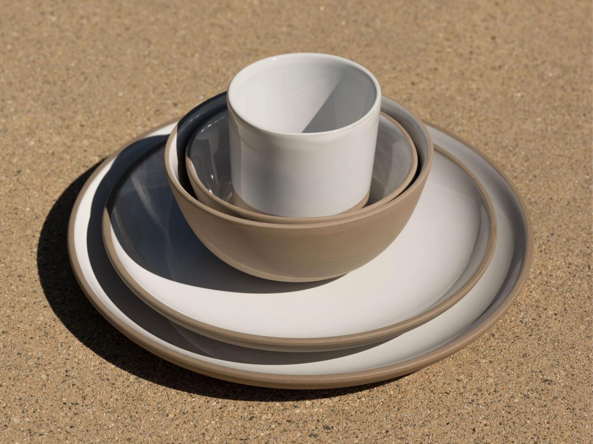 Small gray and white stoneware bowl stacked with matching dishes