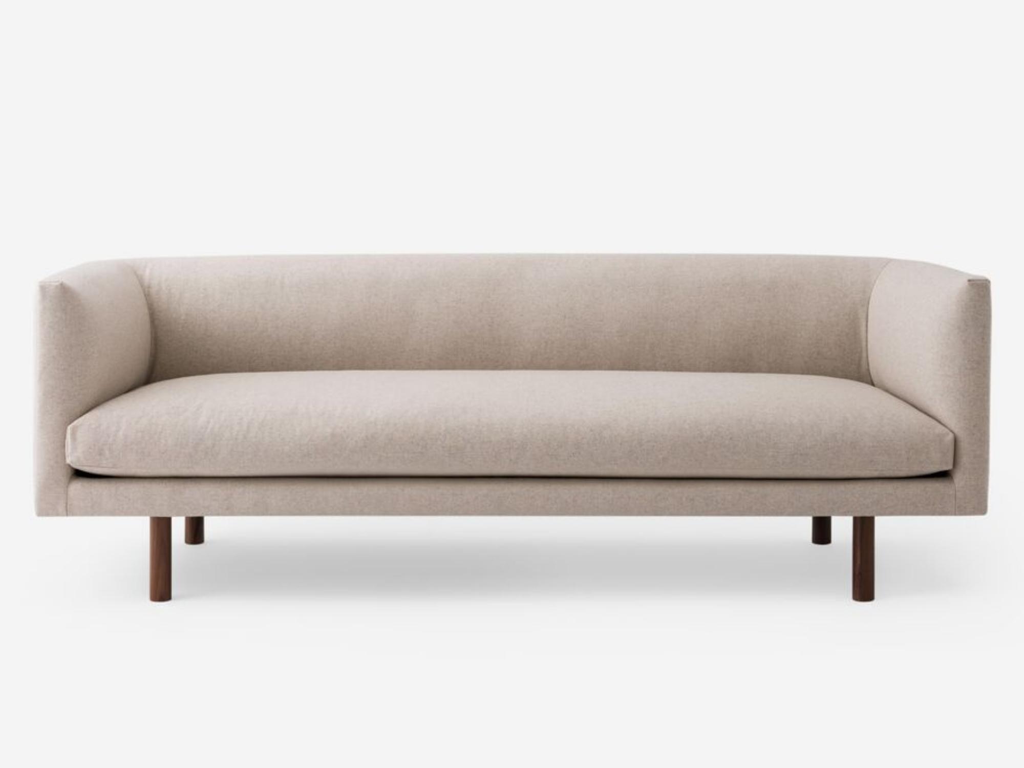 Front view of the Replay modern club couch in white fabric