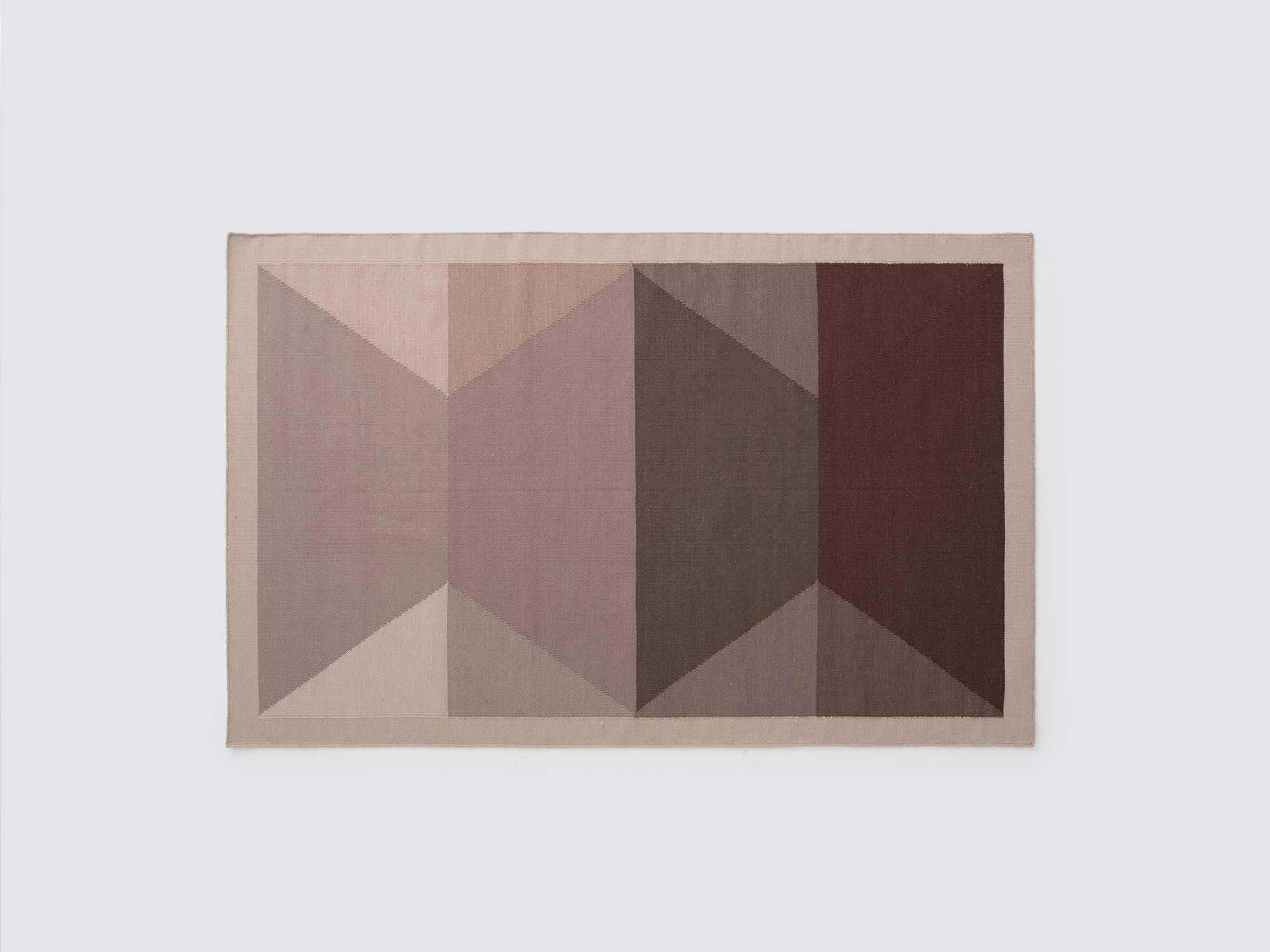 Overhead view of the modern handwoven wool rug in taupe