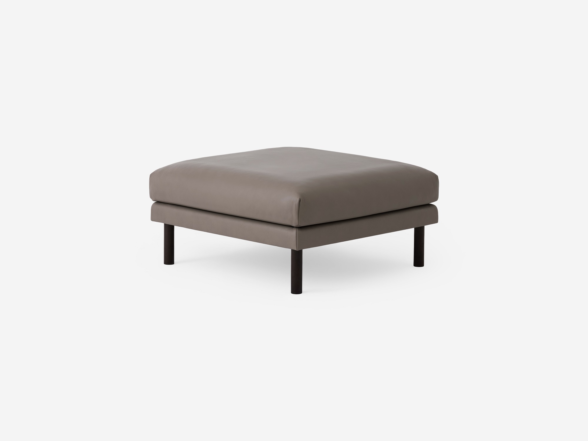 Angled view of the Replay modern ottoman in gray leather