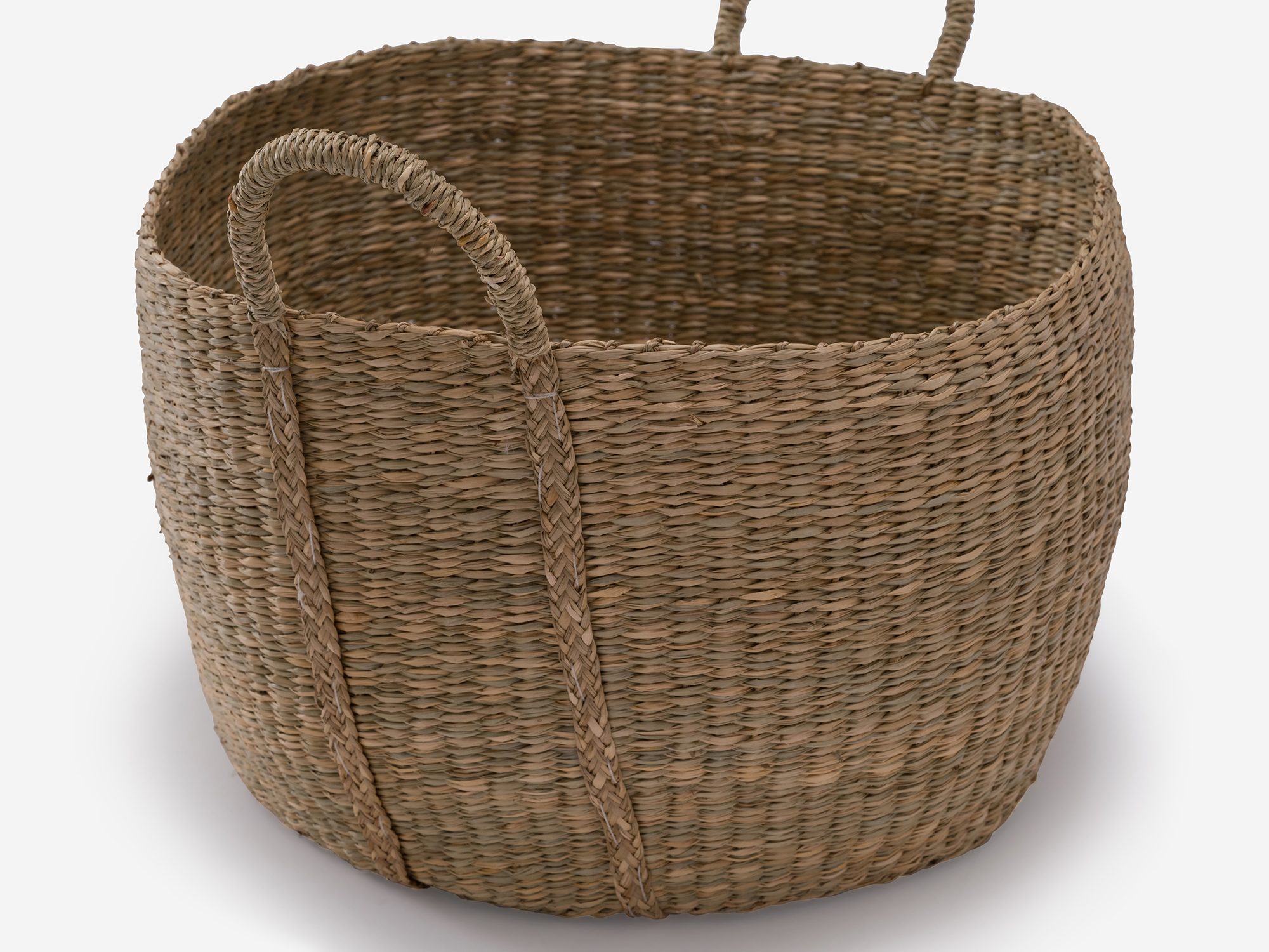 Detail view of large natural woven basket with loops