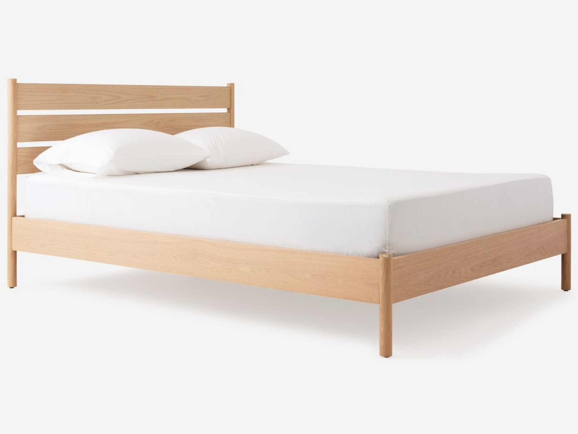 Angled view of our modern oak platform bed, Monarch