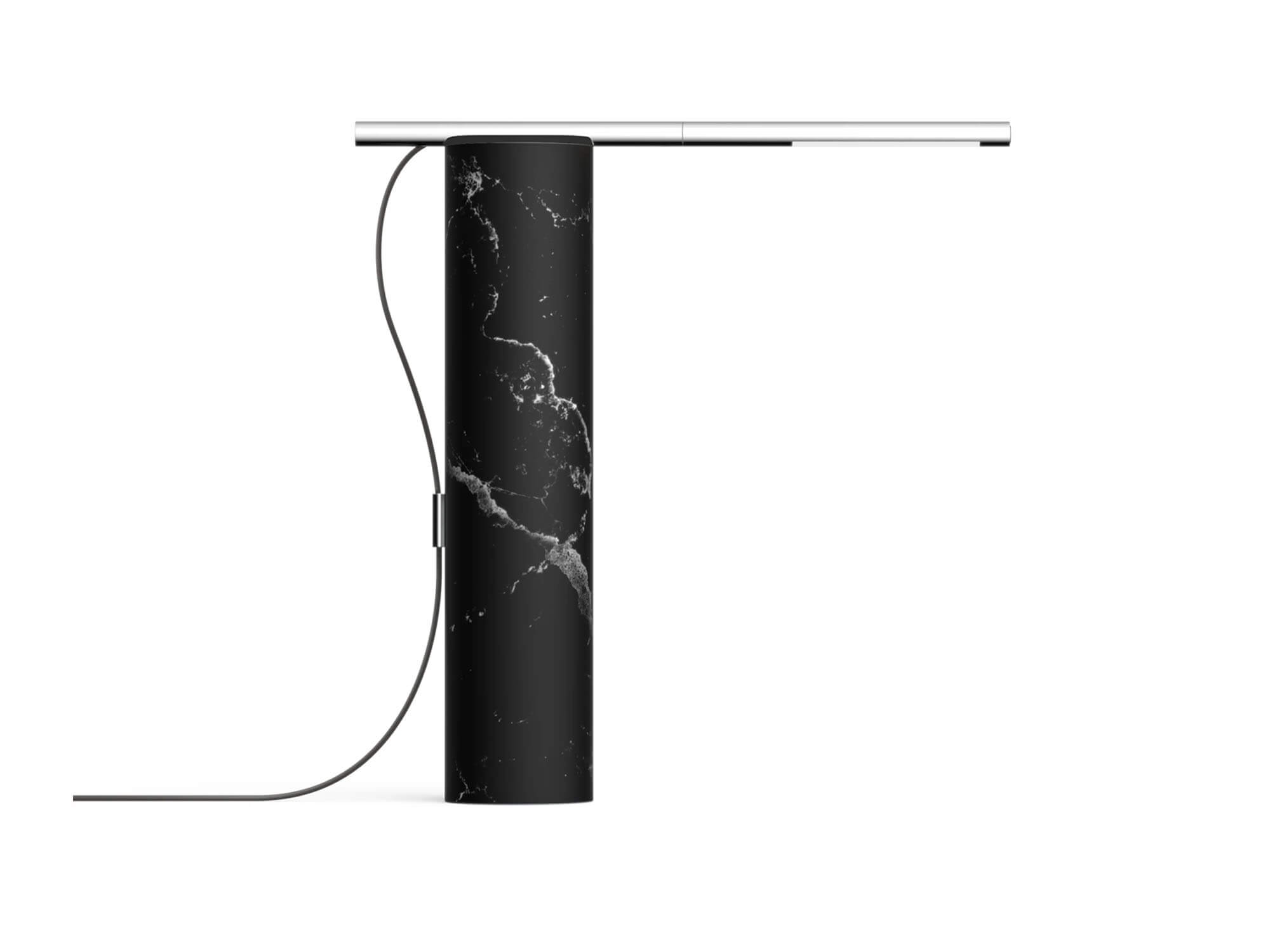 Side view of black marble and stainless steel table lamp