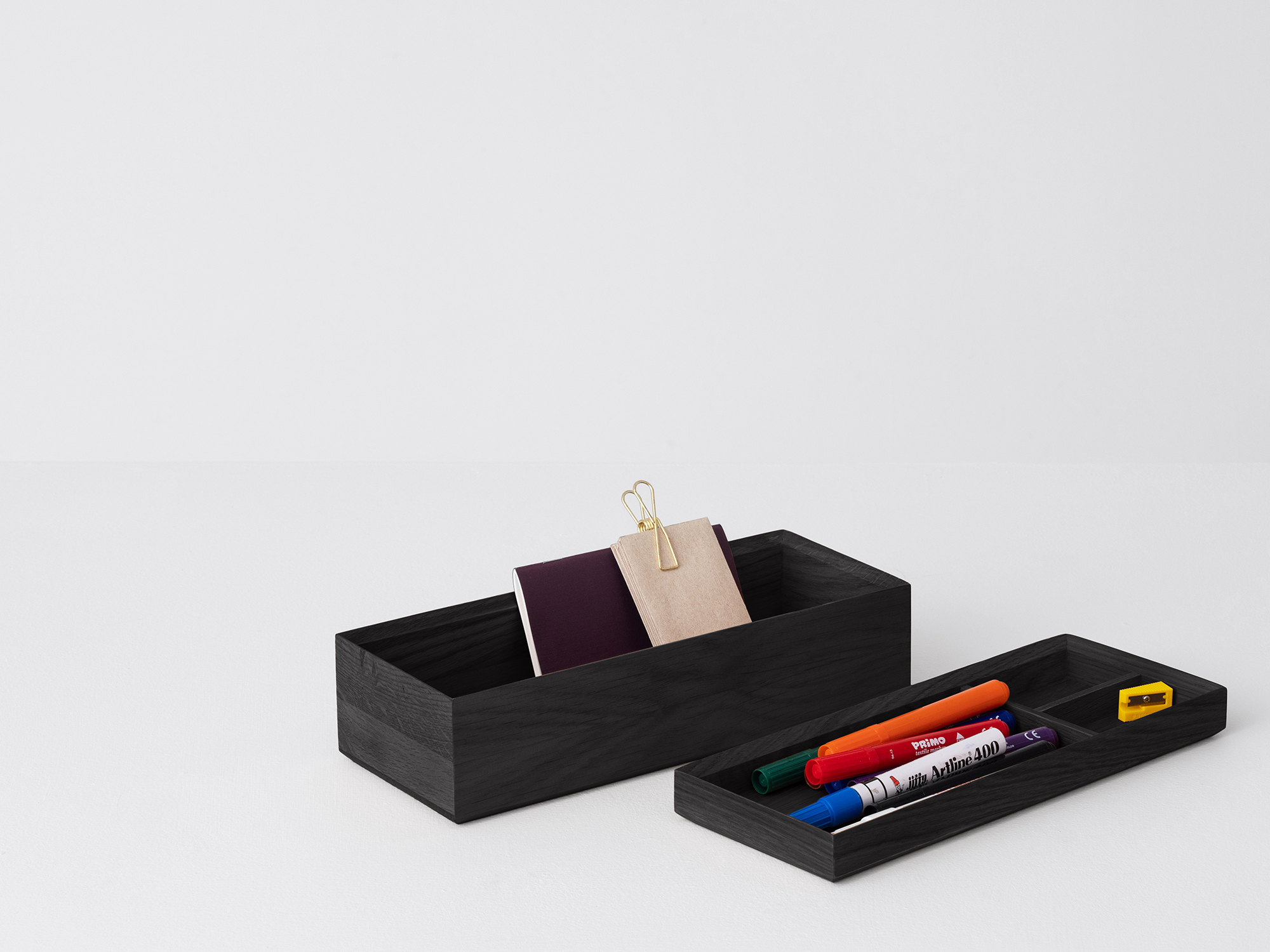 Angled view of the large wooden Draft Pencil Box in black oak unstacked