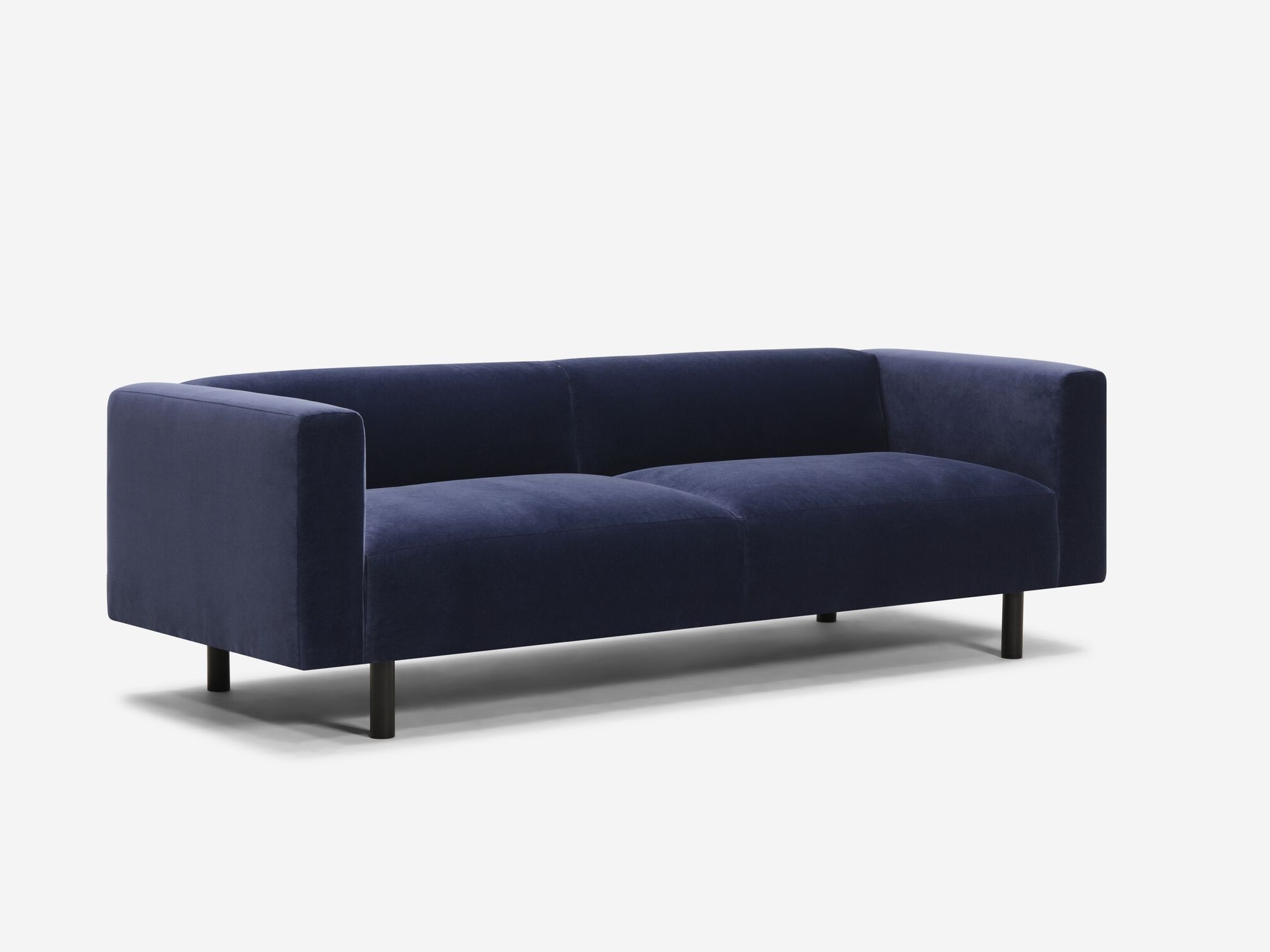 Front angle view of blue velvet sofa