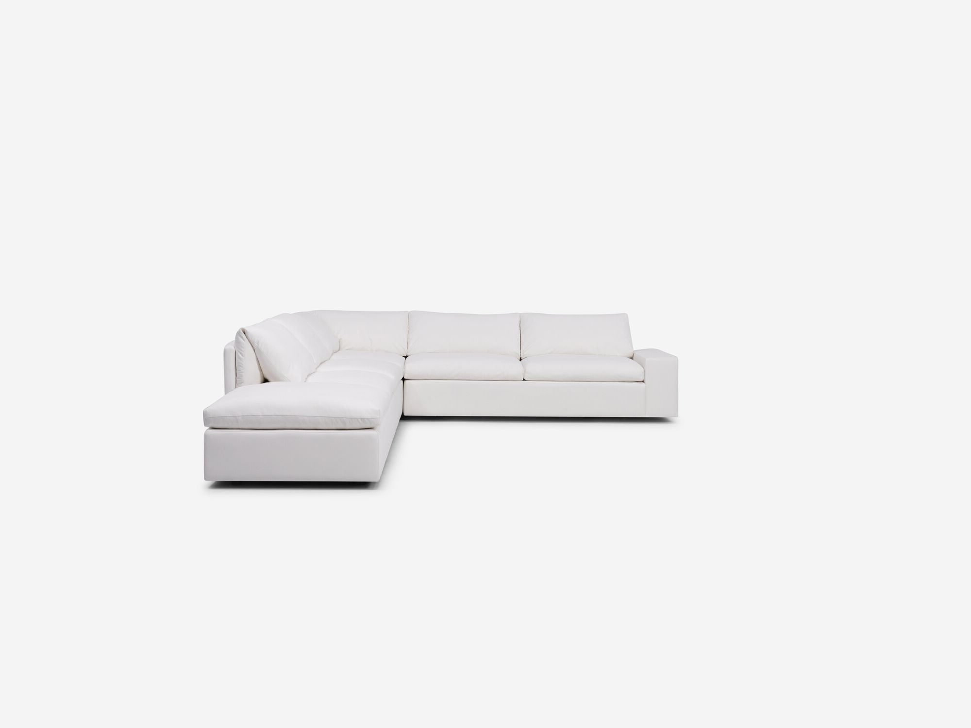 White sectional sofa with left hand chaise and wide arms front view
