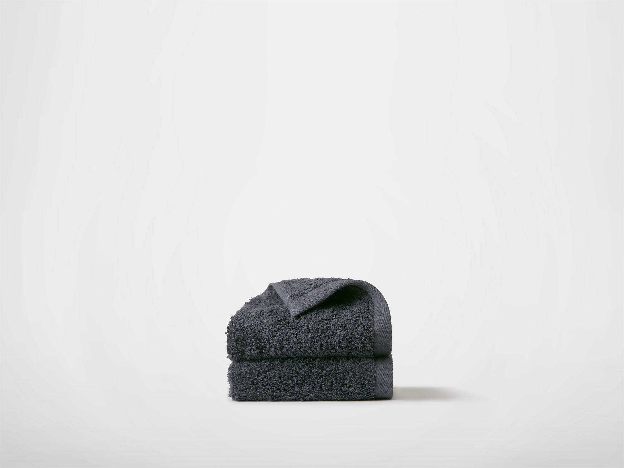 Side view of dark grey washcloths