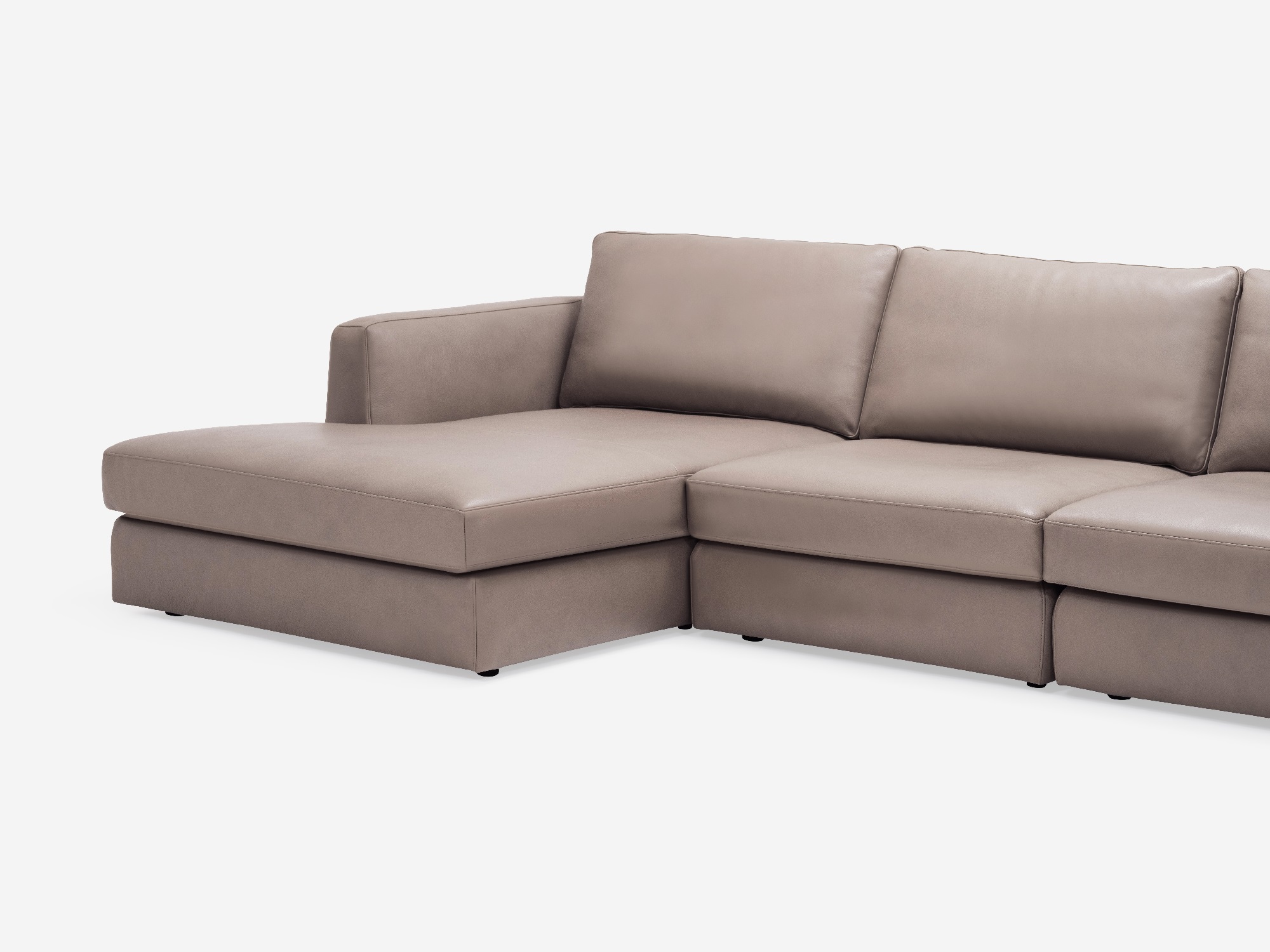 Detail view of the Cello modular sofa in beige leather with left hand chaise