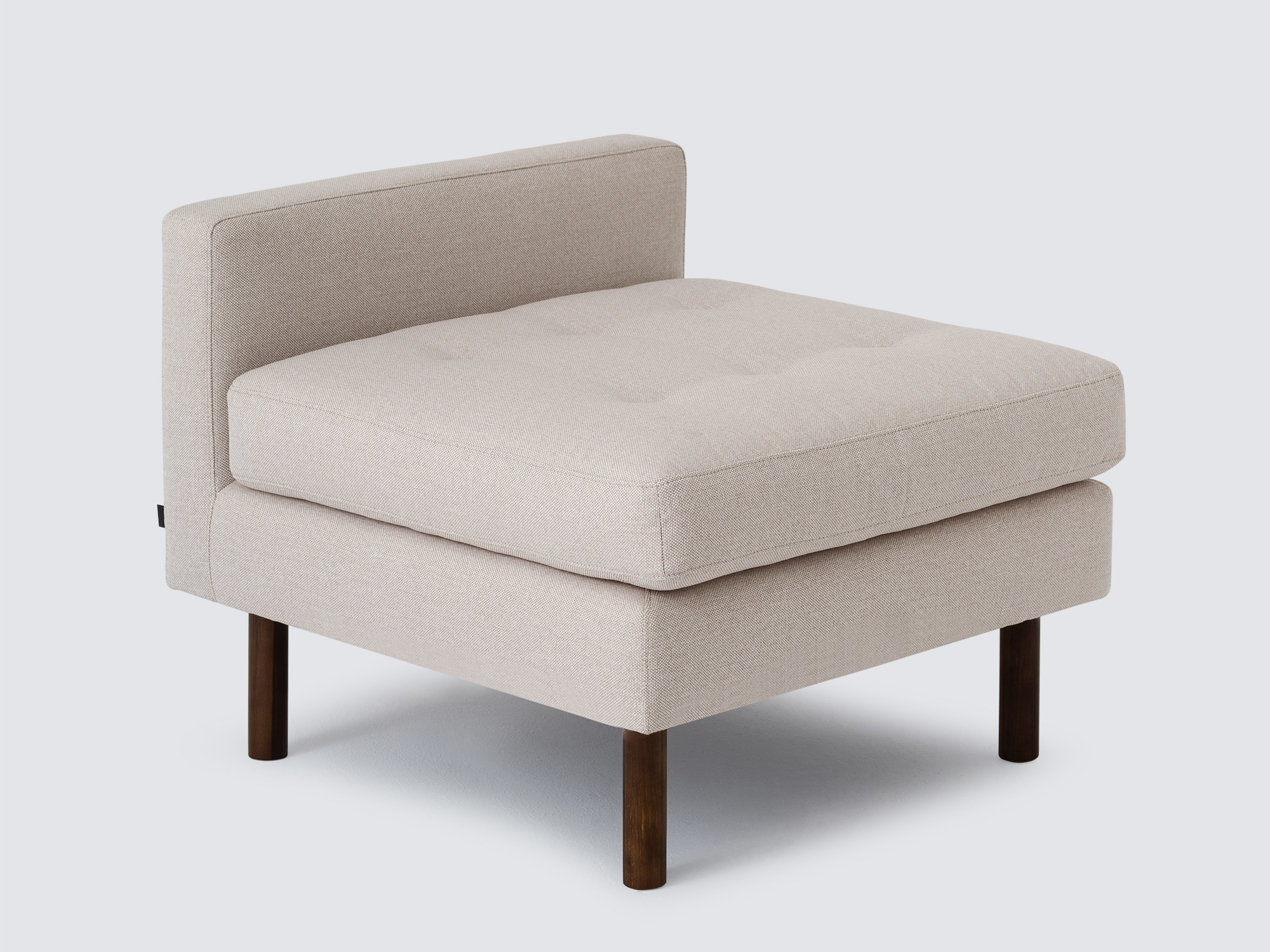 Front detail view of the Joan extended chair upholstered in beige fabric