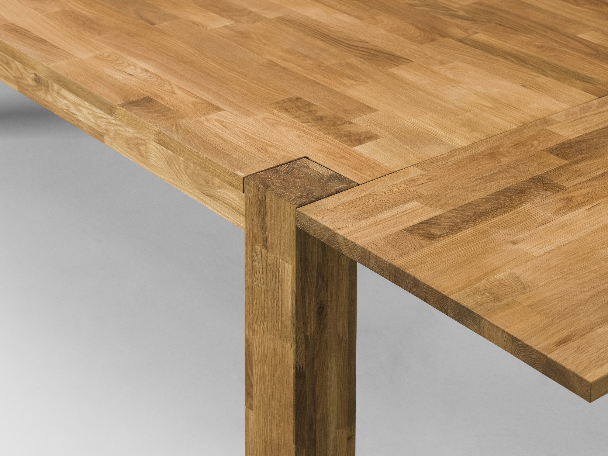 Detail view of oak Harvest rustic dining table with leaf