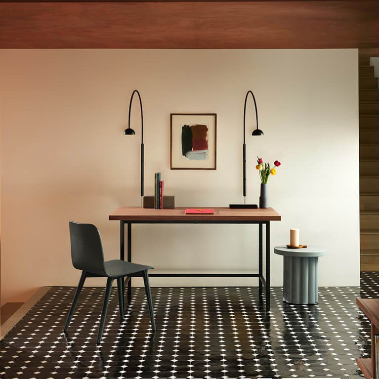 Walnut desk and black oak chair is shown in a home office setting. Link to office category
