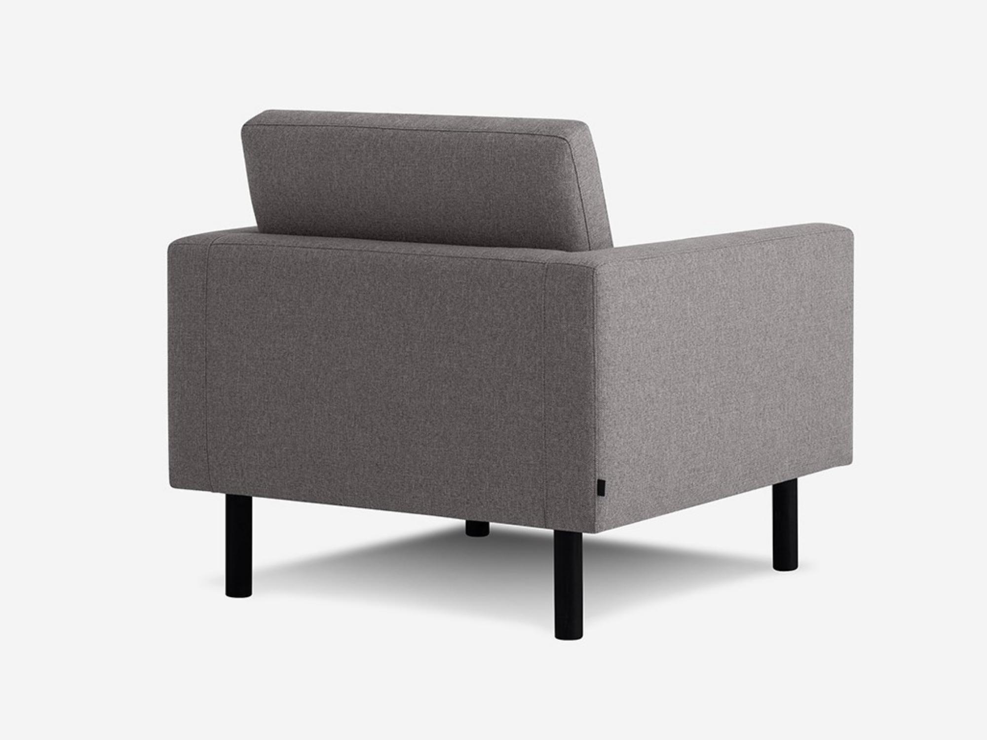 Back angled view of the Joan contemporary chair upholstered in grey fabric