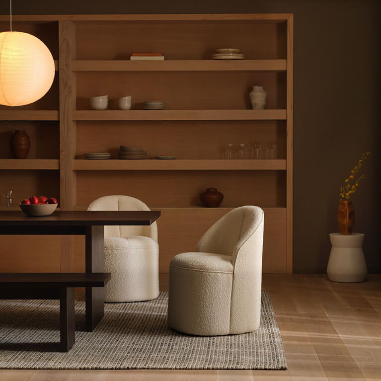 White fabric chair is shown in a dining room setting. Link to dining category