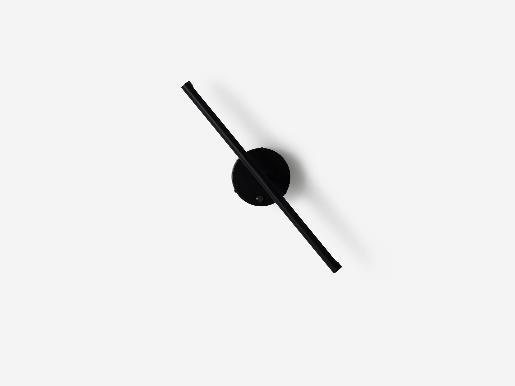 Front view of angled black slim wall lamp
