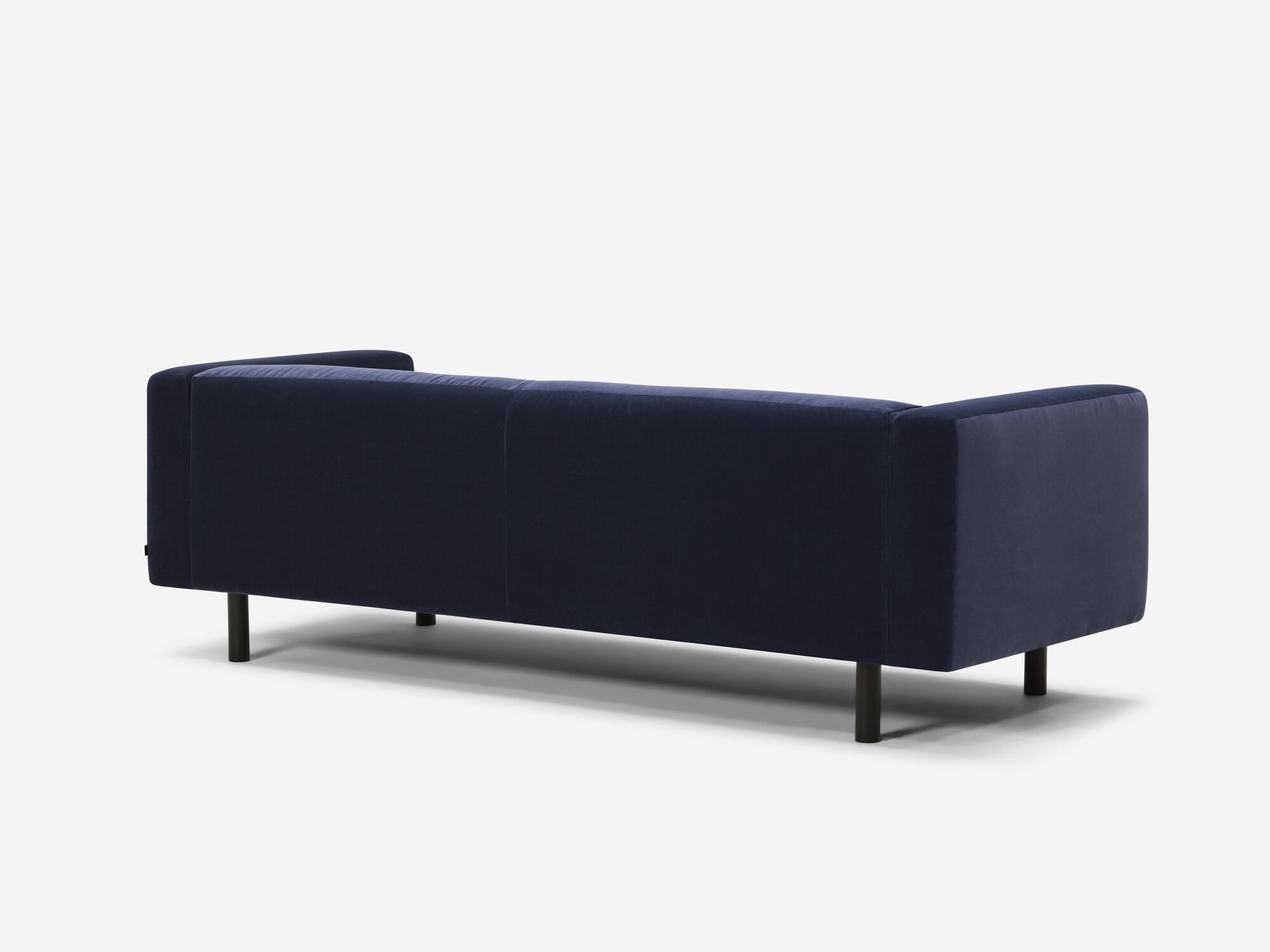 Back angle view of blue velvet sofa