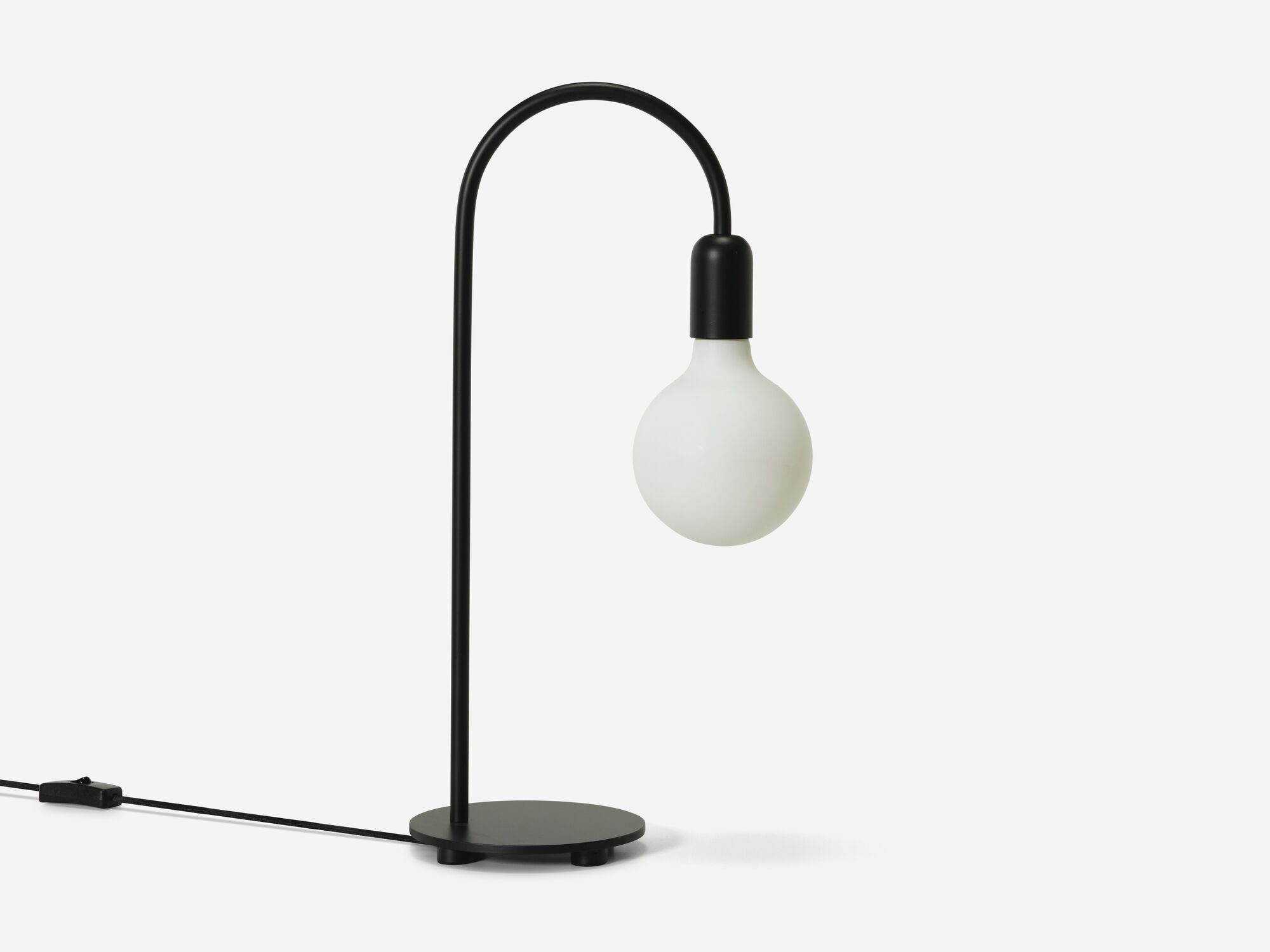 Side view of black curved table lamp