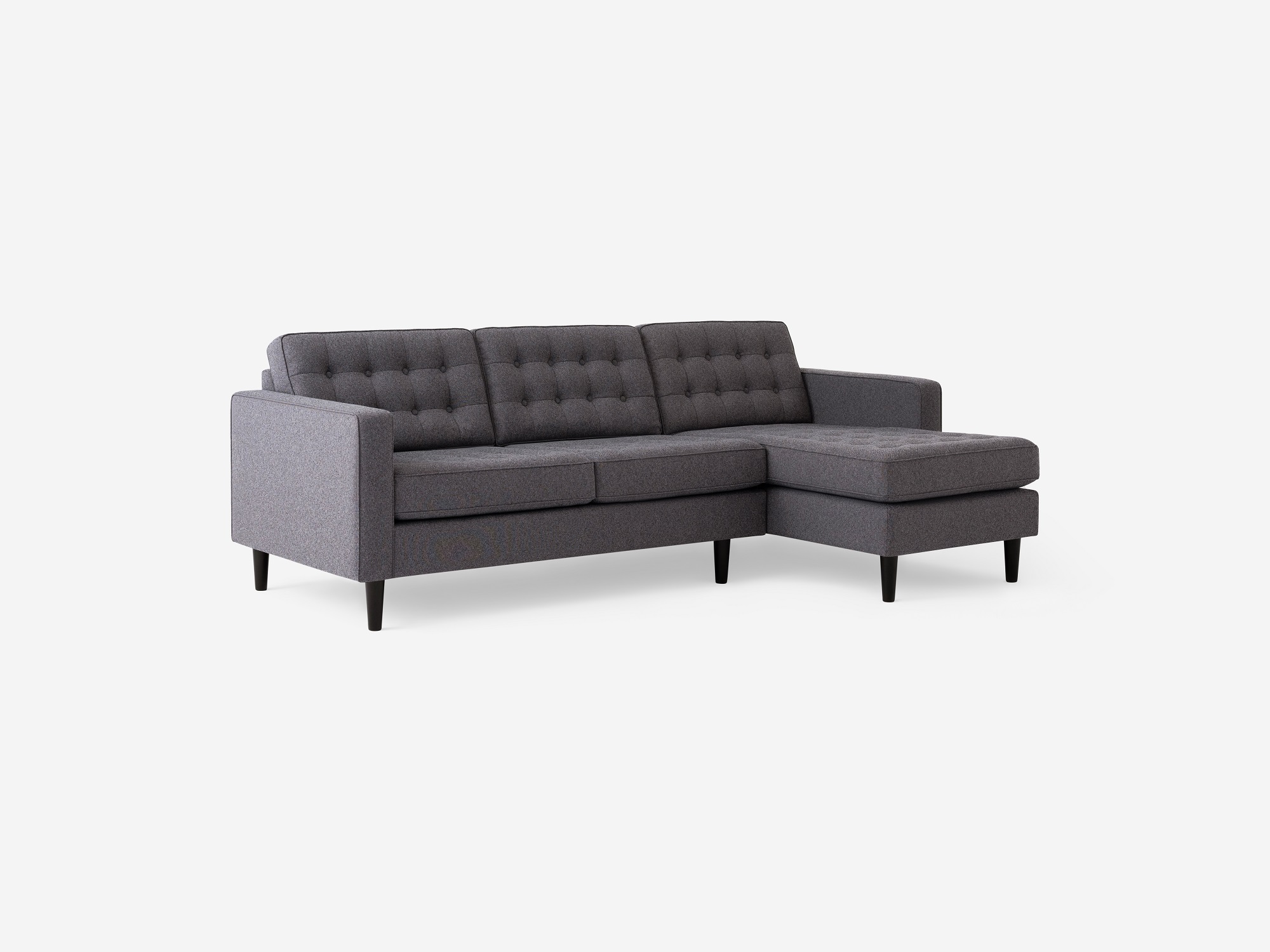 Corner view of the  Reverie mid-century sectional sleeper sofa in gray fabric