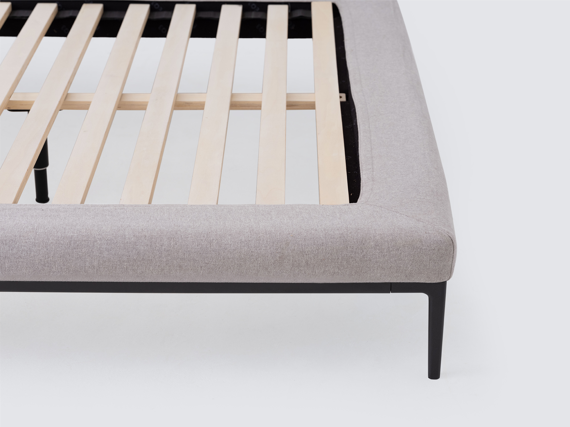 Slats view of the Oma upholstered bed in gray fabric