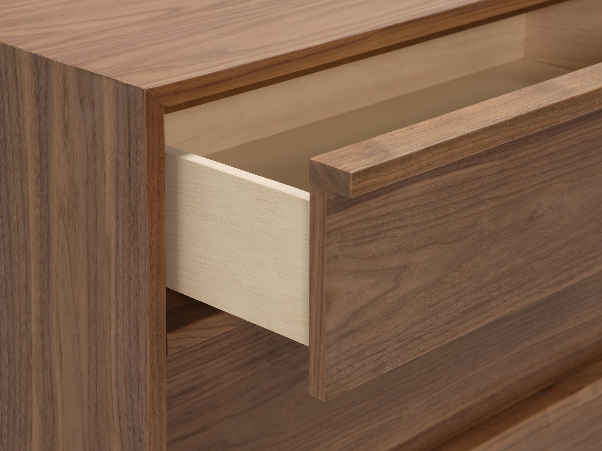Modern walnut single dresser with top drawer open detail corner view