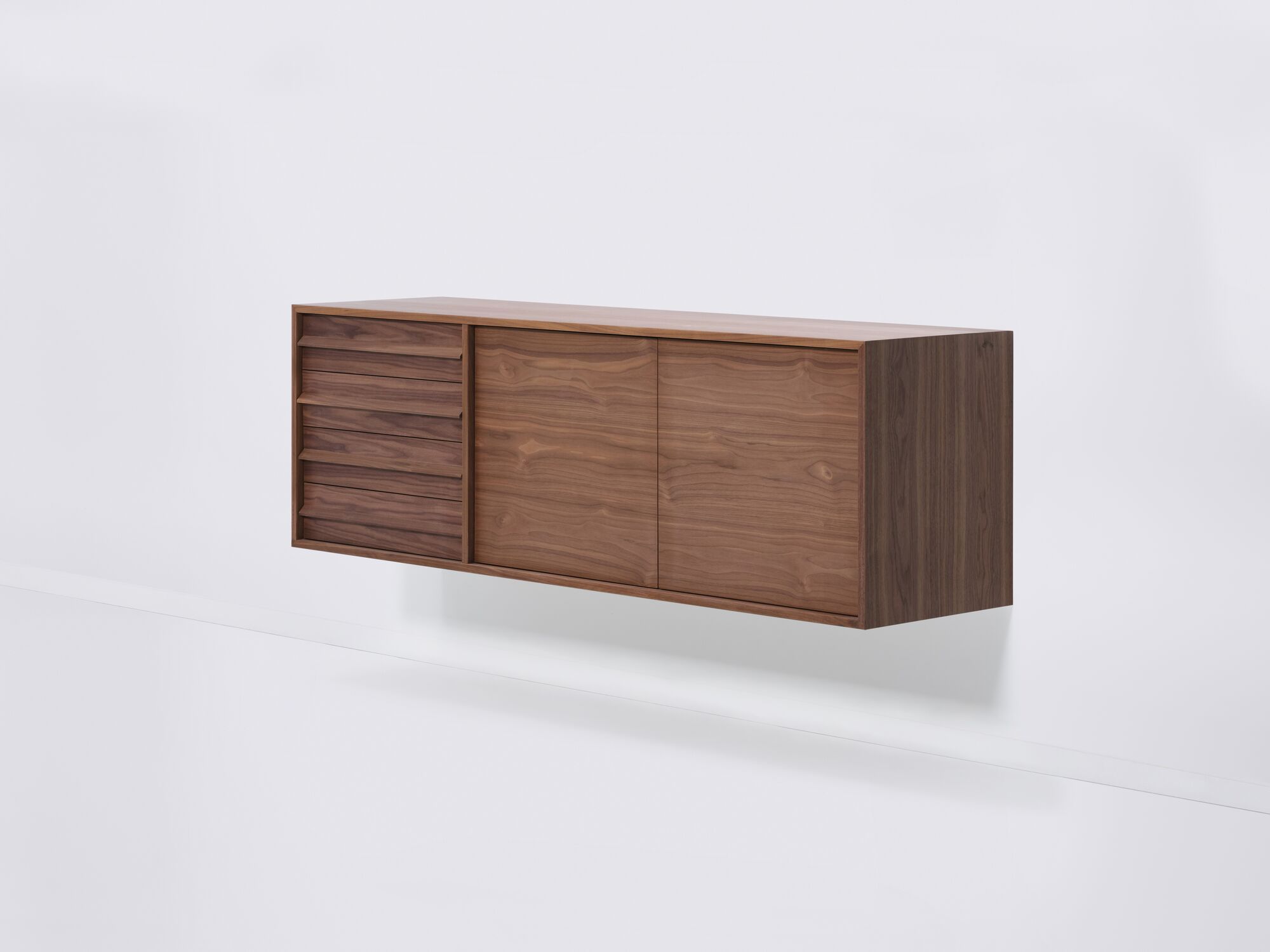 Right side view of large walnut mid century floating sideboard