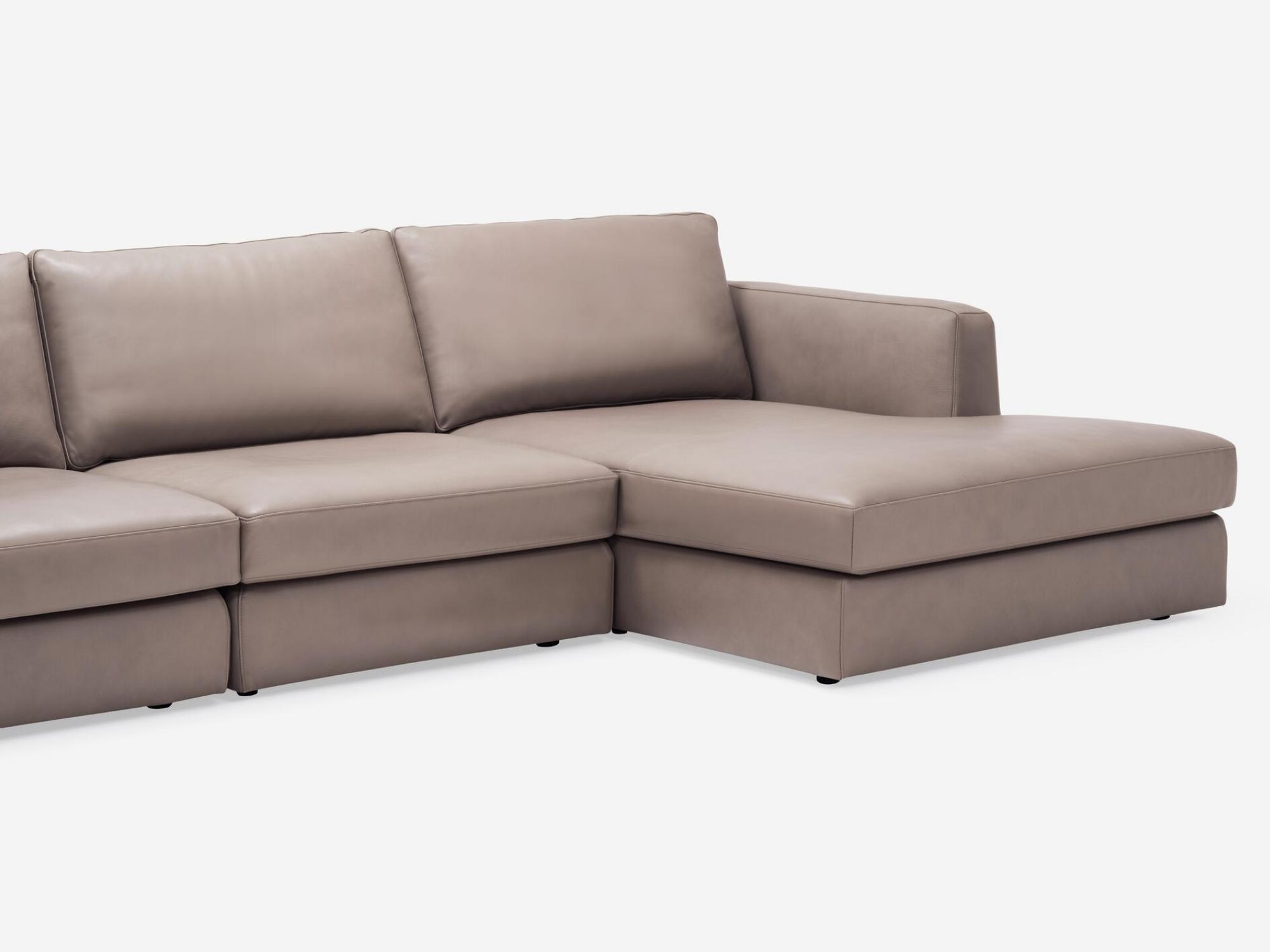 Detail view of the Cello modular sofa in beige leather with right hand chaise