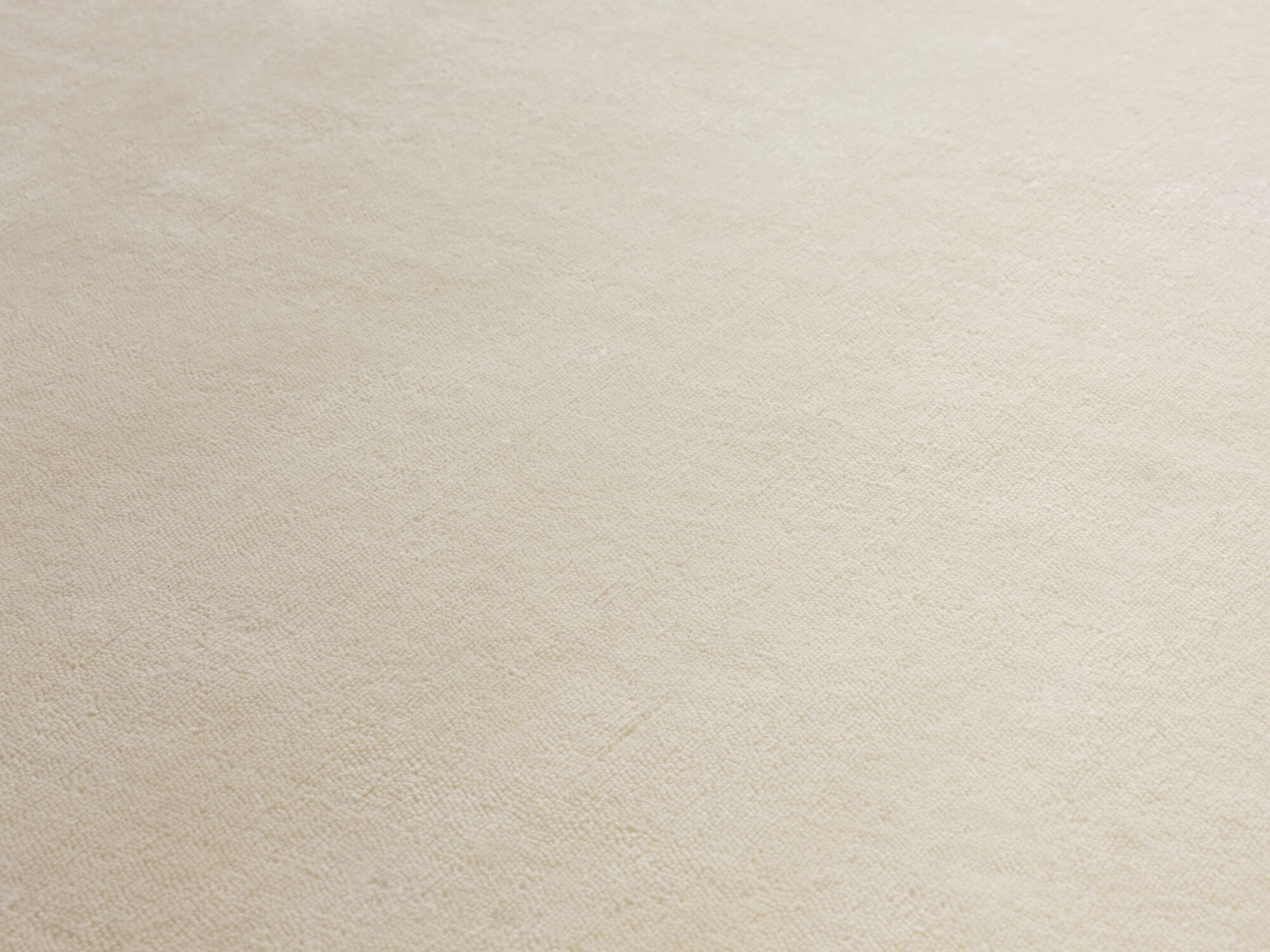 Detail view of large durable cream area rug