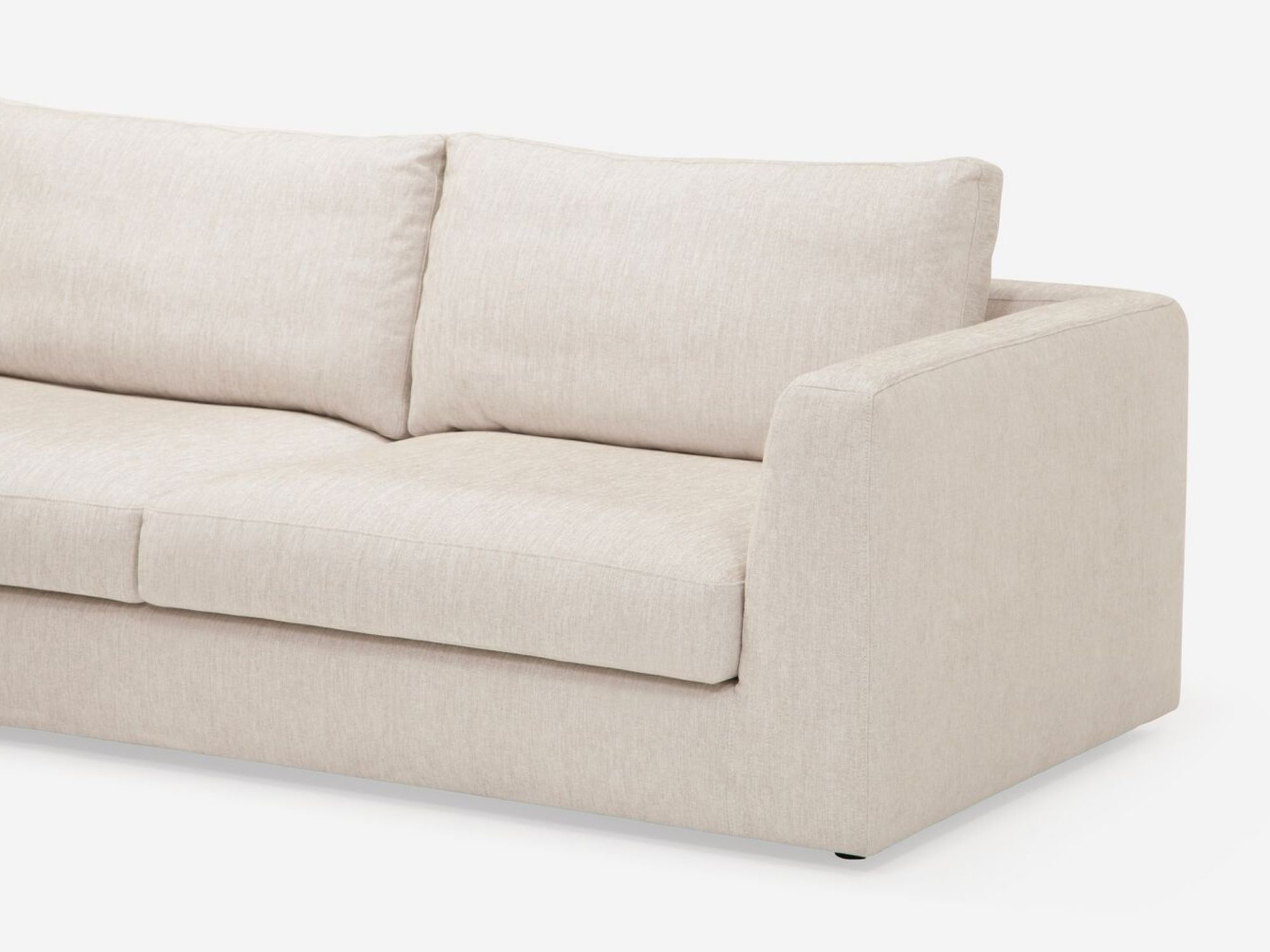 Detail view of the modern sectional couch in white fabric chaise