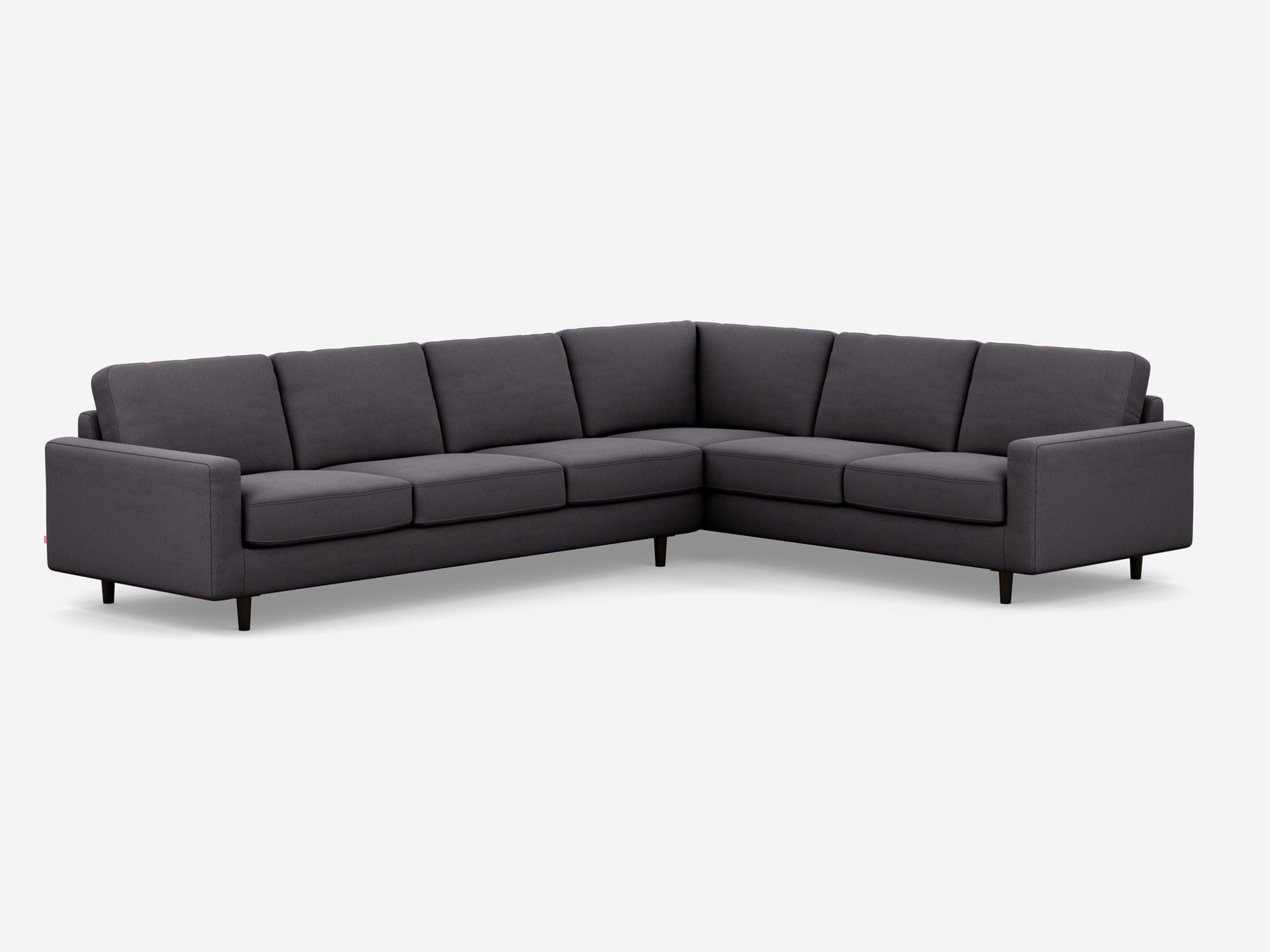 Corner view of the Oskar right hand facing l shape sofa in dark grey fabric.