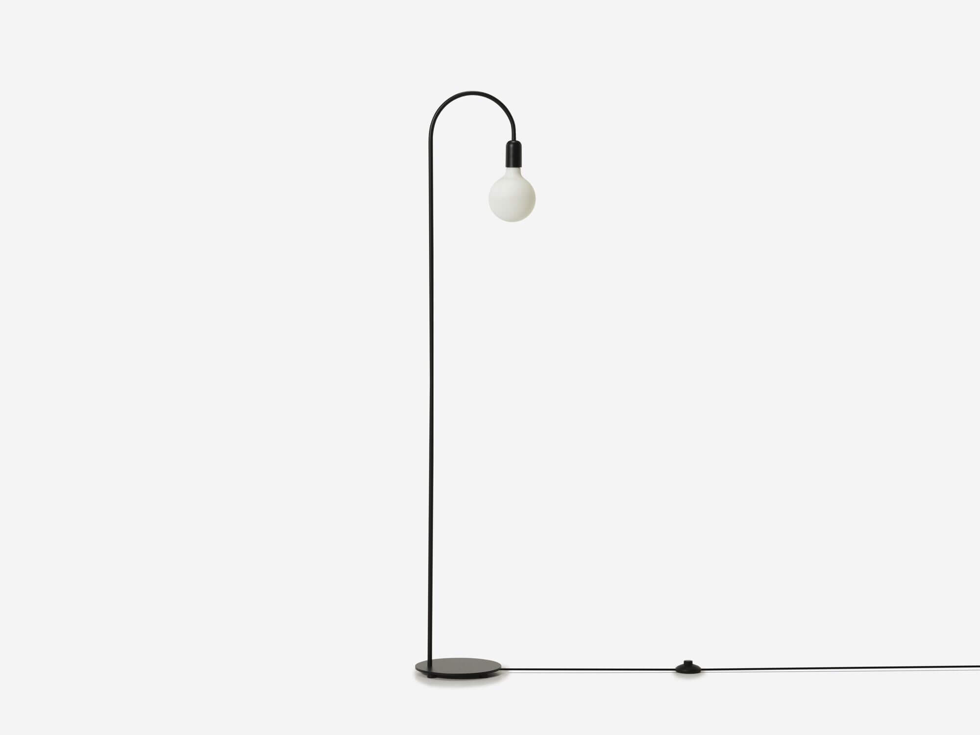 Side view of black arched floor lamp