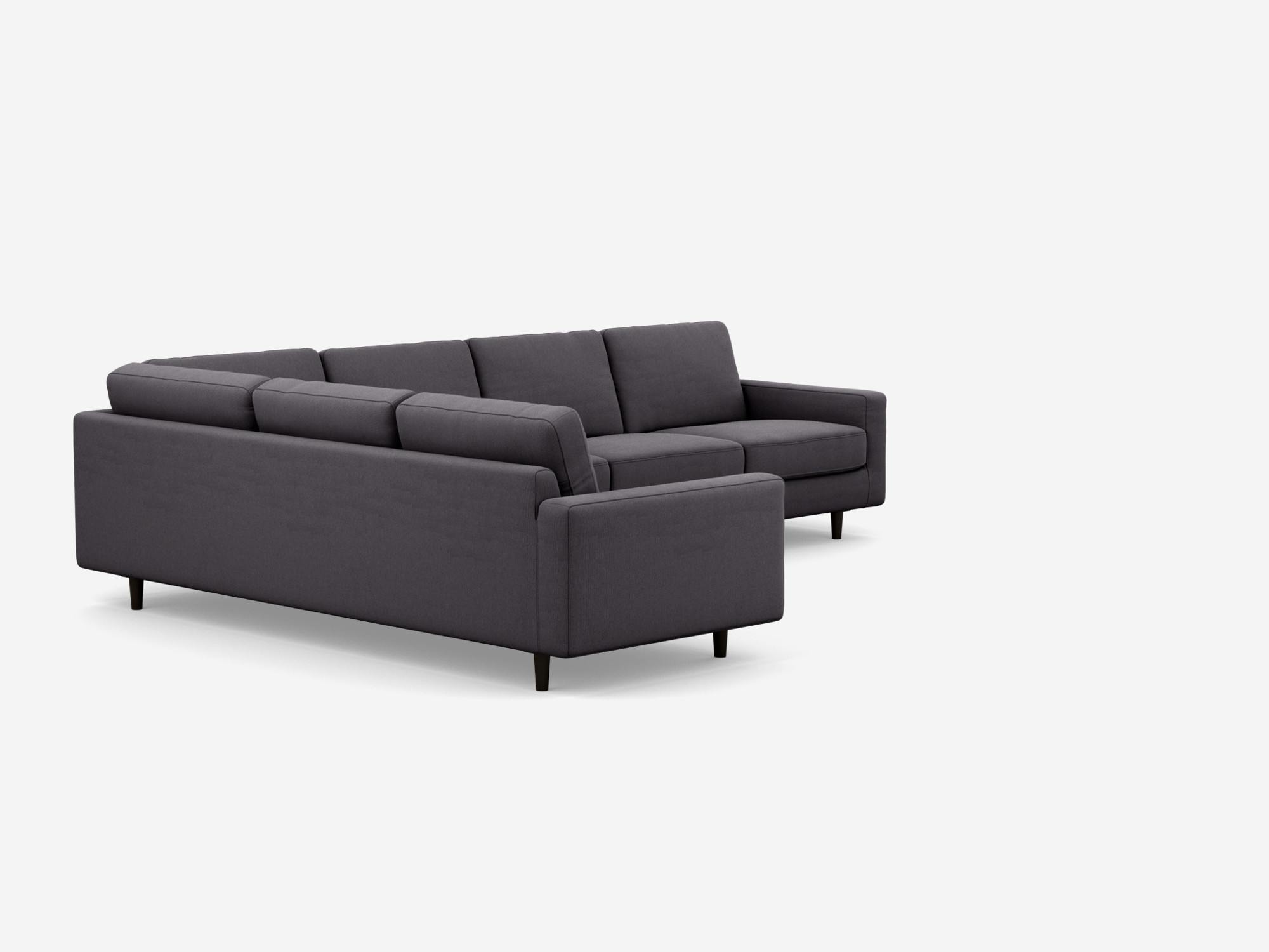 Angled view of the Oskar l shape sofa in dark grey fabric.