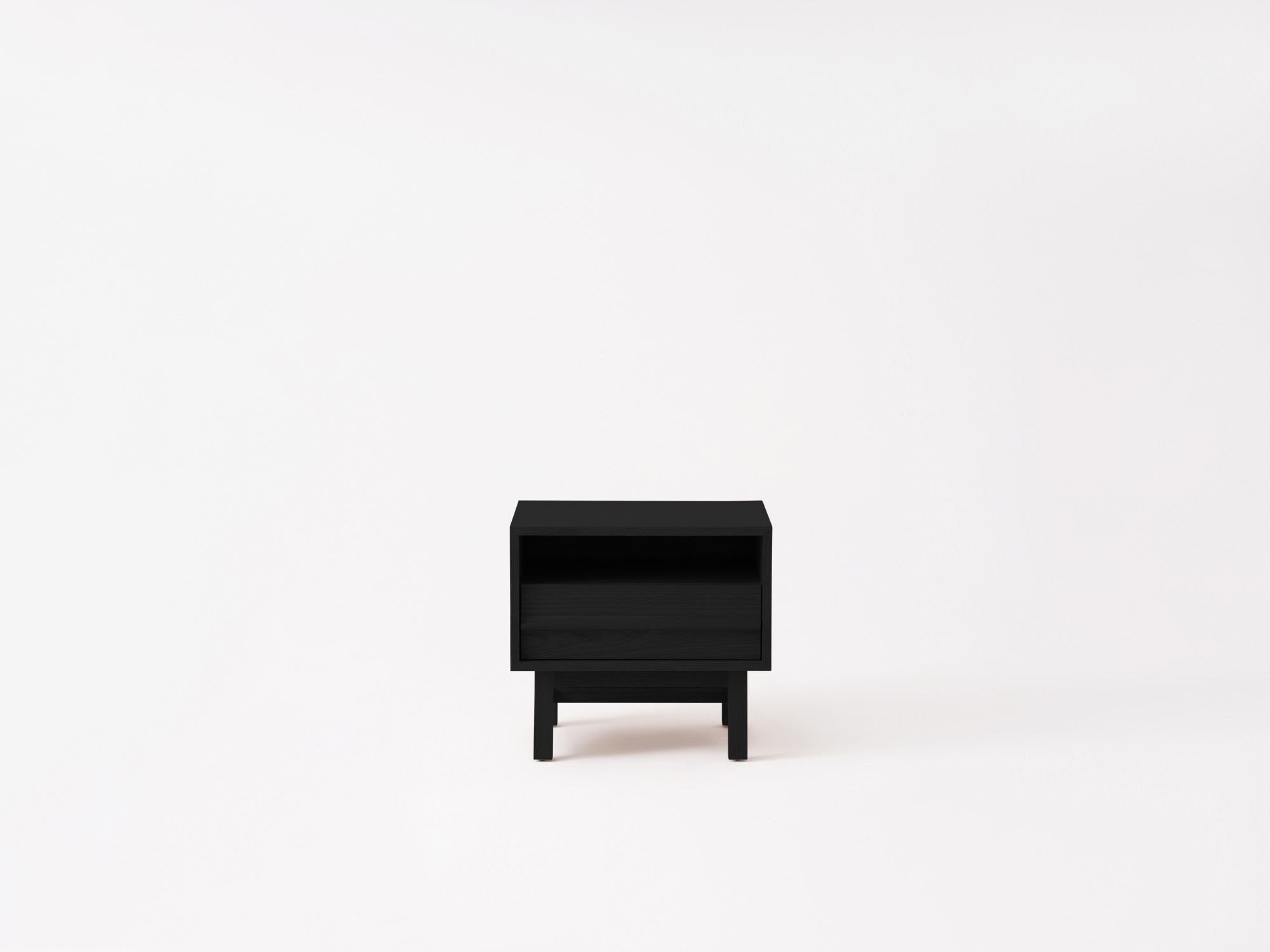 Front view of the Marcel open shelf modern nightstand in black oak