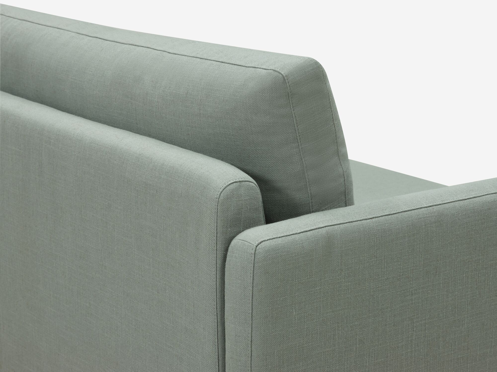 Wide teal armchair detail view