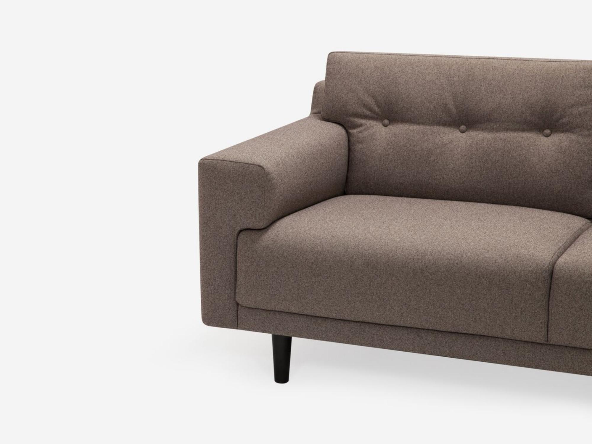 Detail view of the Remi 101" modern sectional sofa with buttons in grey fabric