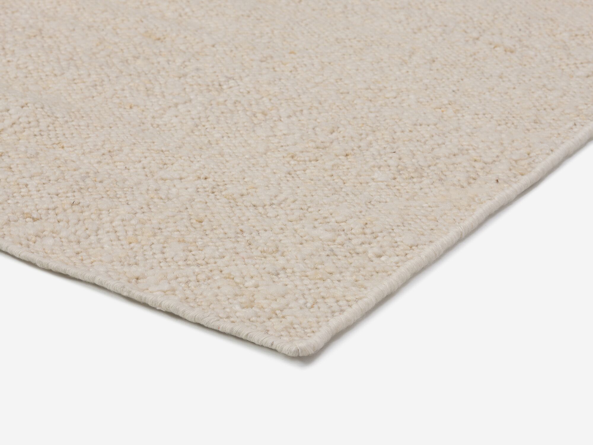 Detail corner view of braided beige hallway runner detail