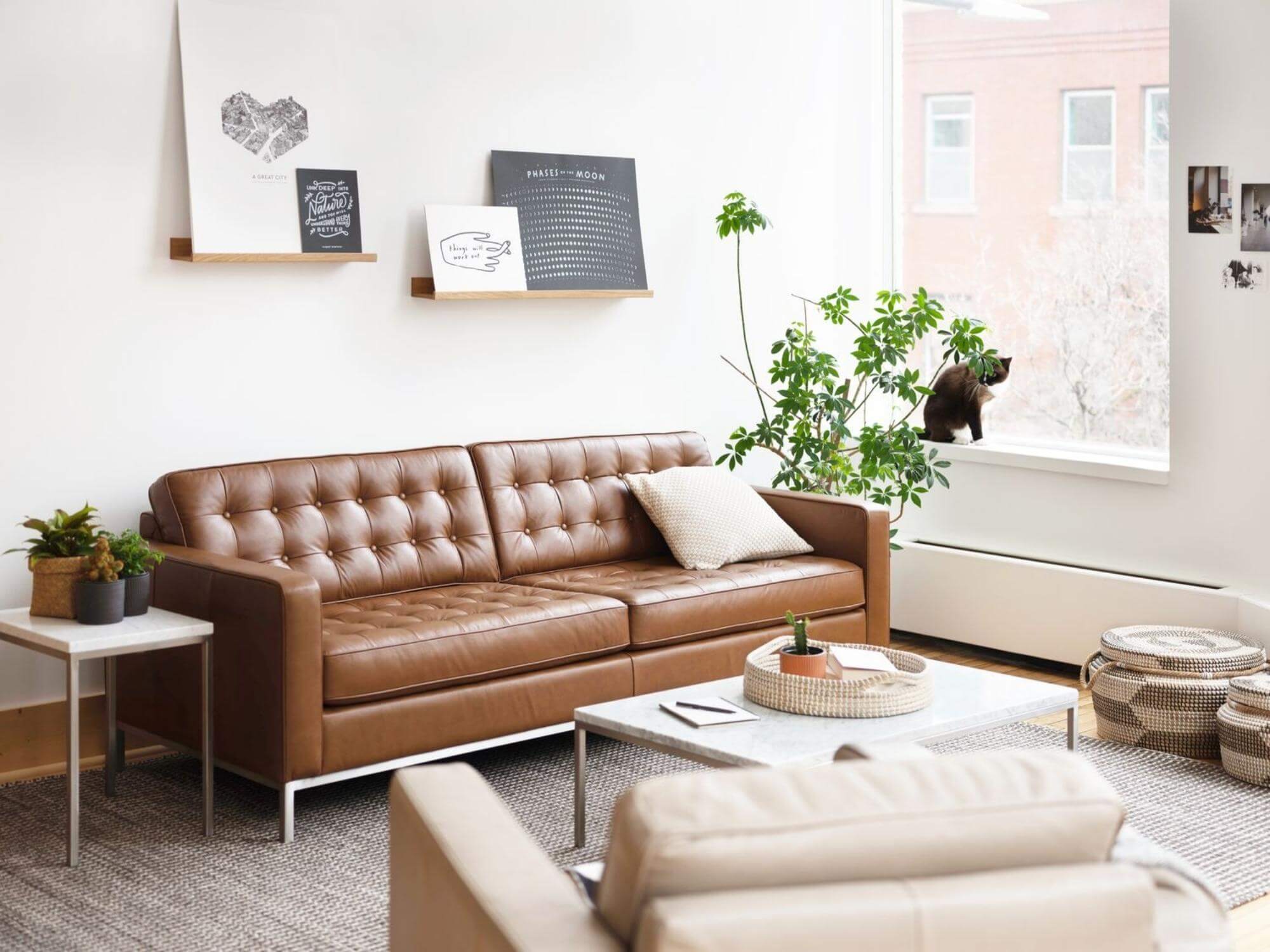 Wooden art ledges on wall over mid century sofa