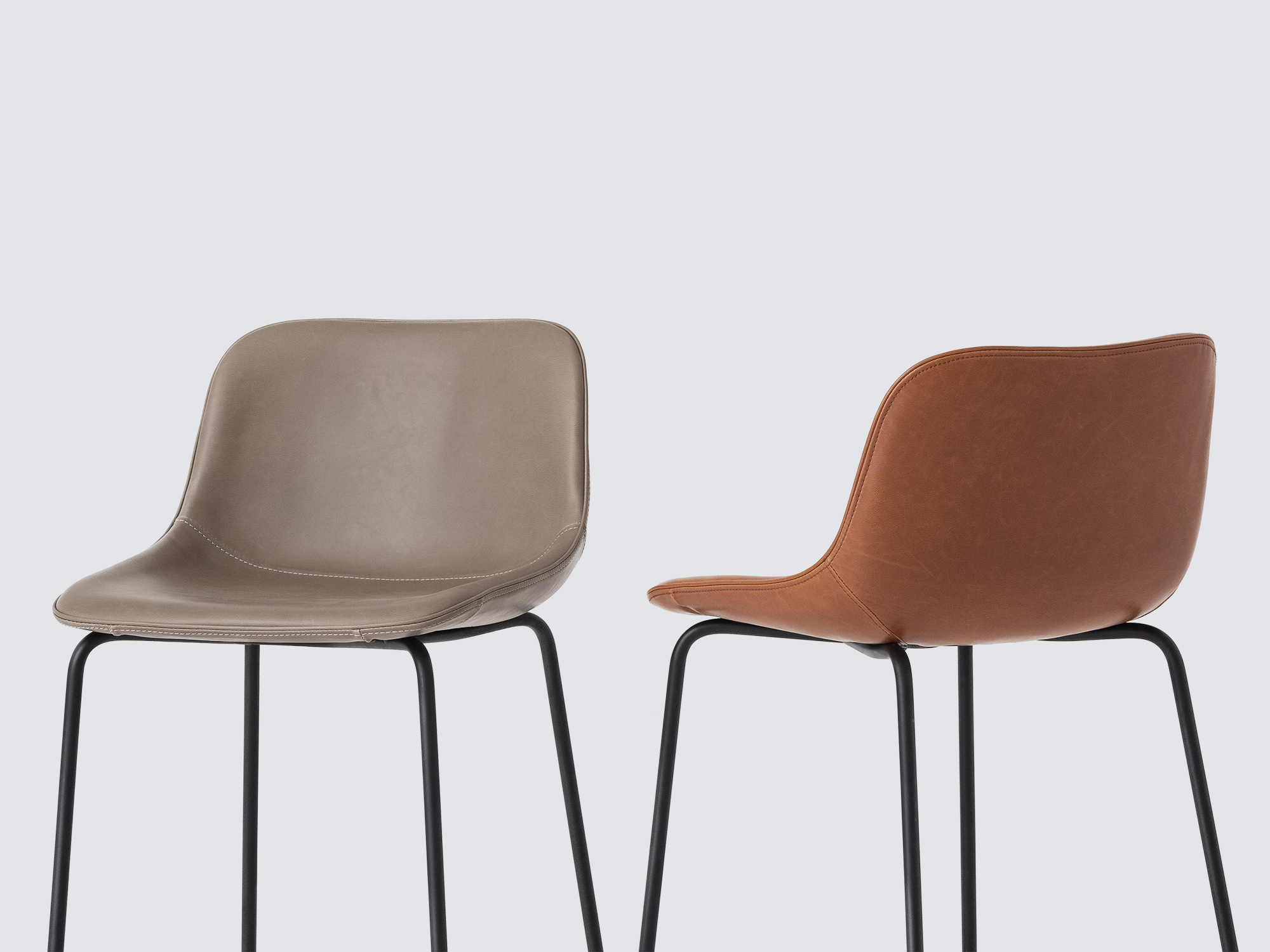 Detail view of two of the Oles counter height bat stool with grey and brown seats