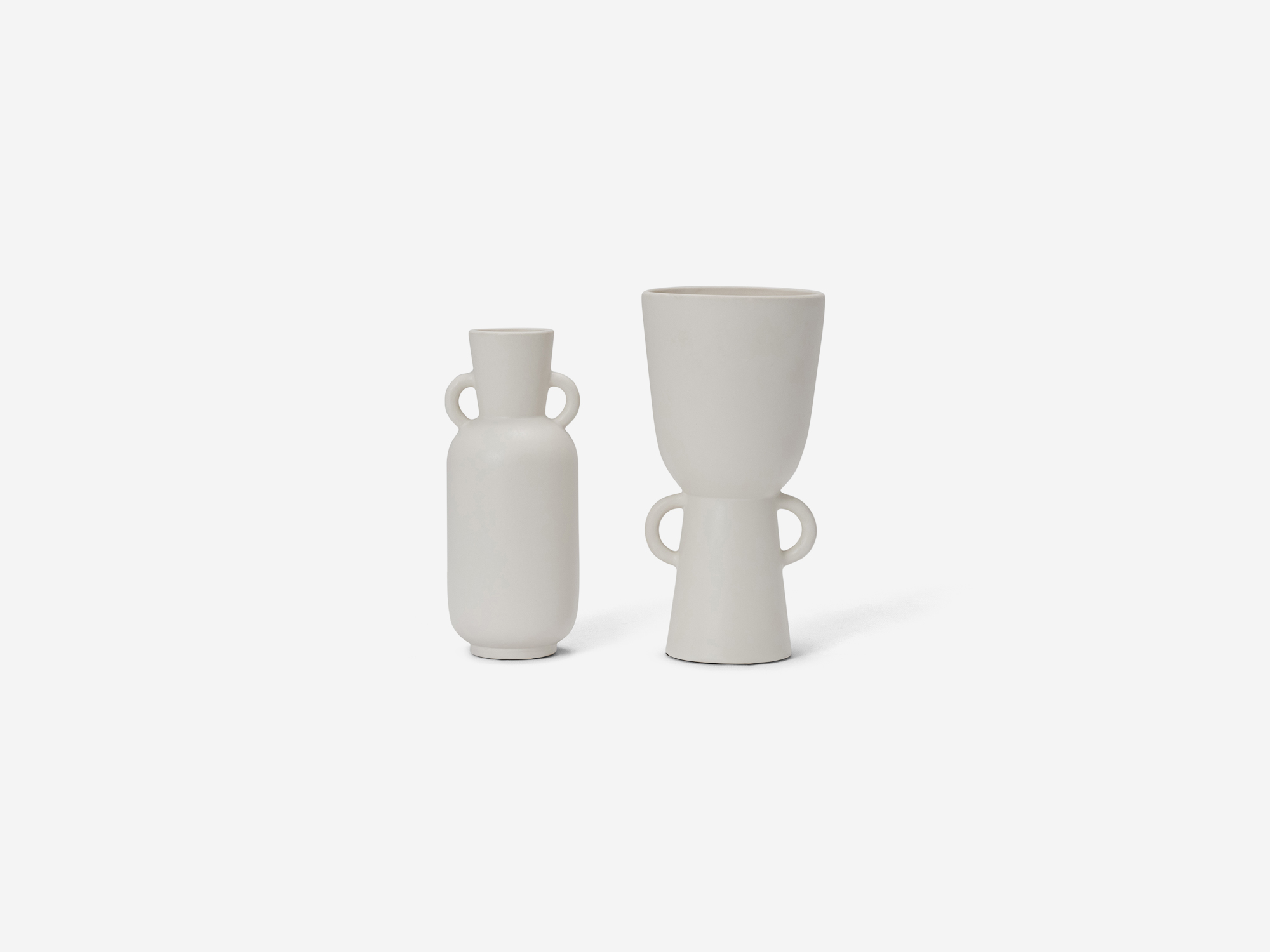 Front view of two white vases