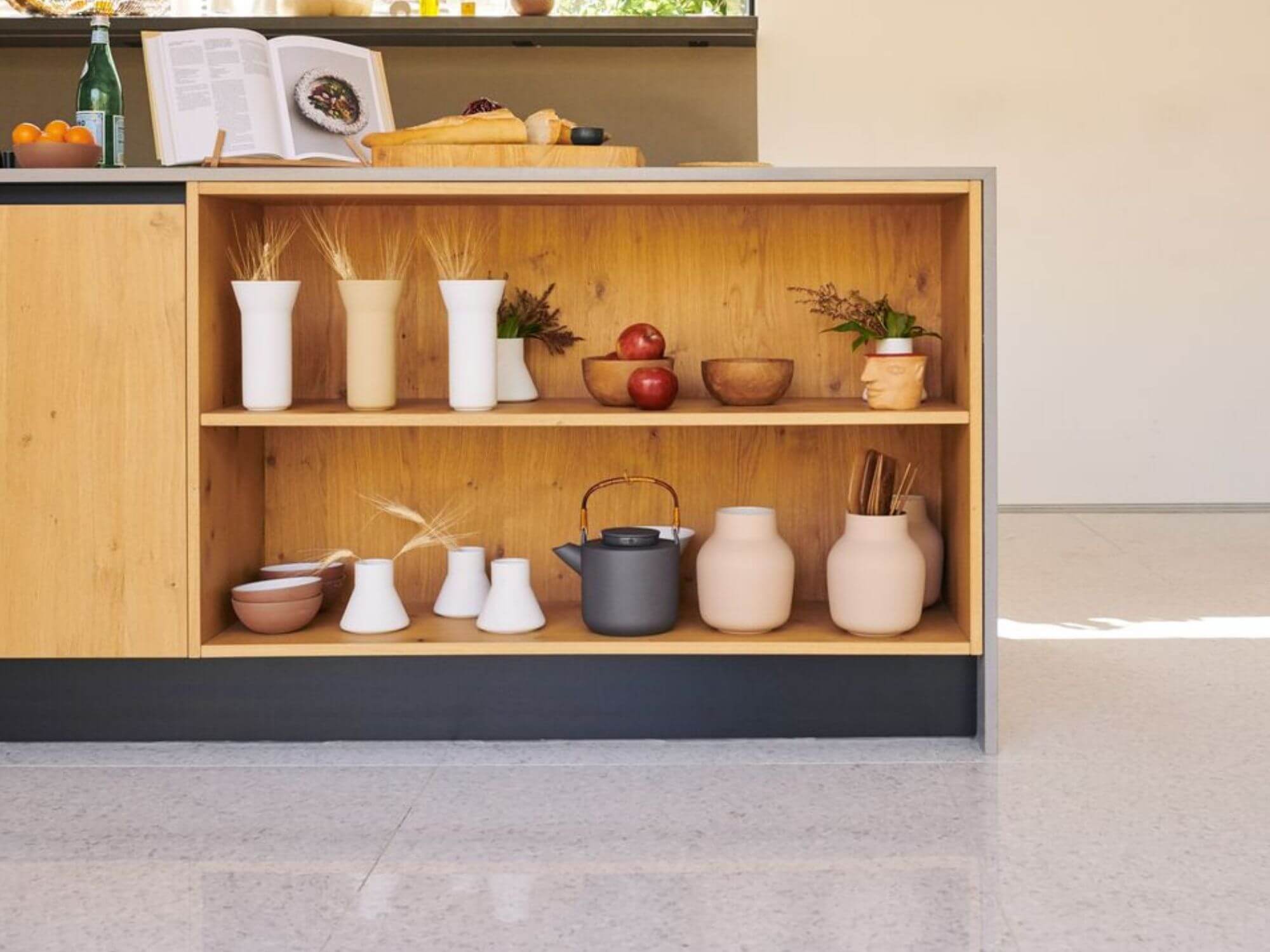 Grey stoneware tea pot on open shelving