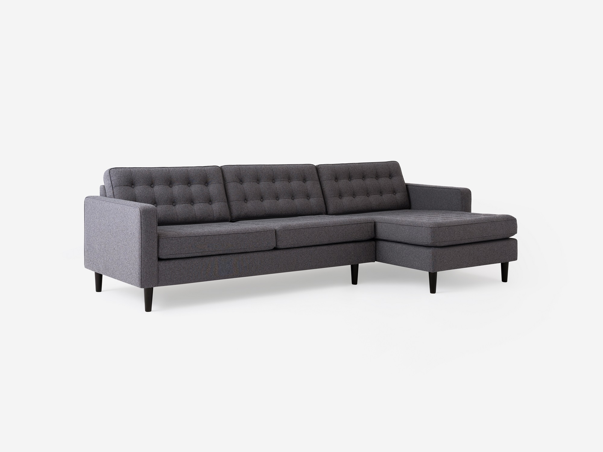 Corner view of the  Reverie modern sectional sleeper couch in beige fabric