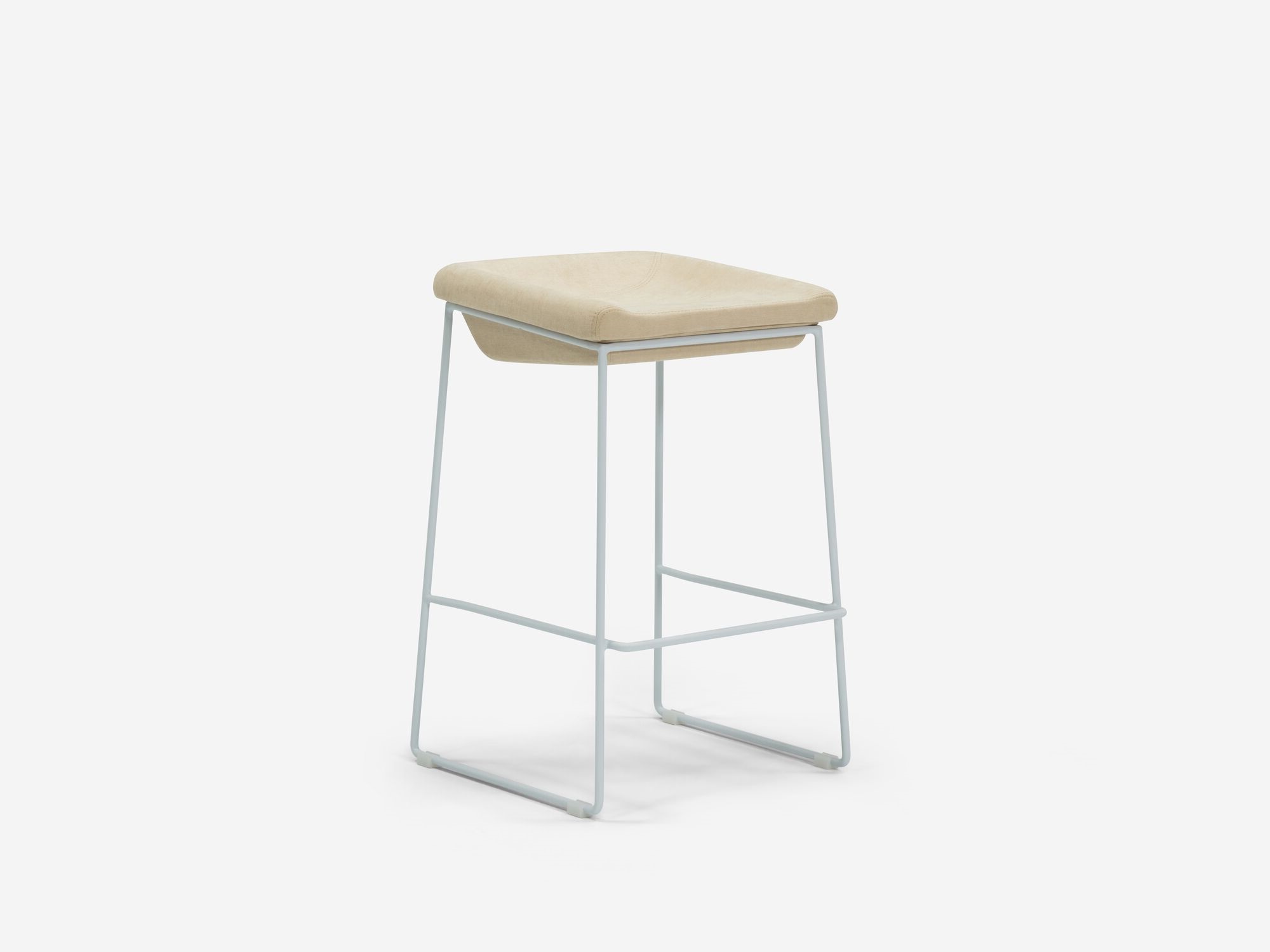 Counter stool with beige seat and white legs front angle view