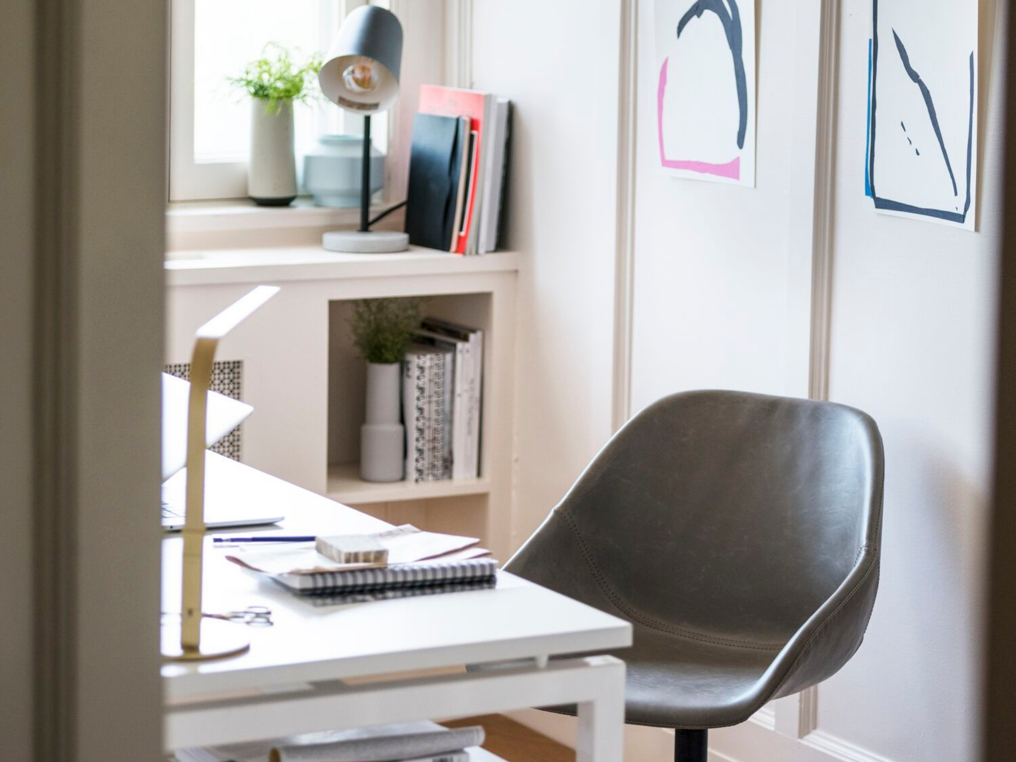 Black desk lamp on shelf of modern home office