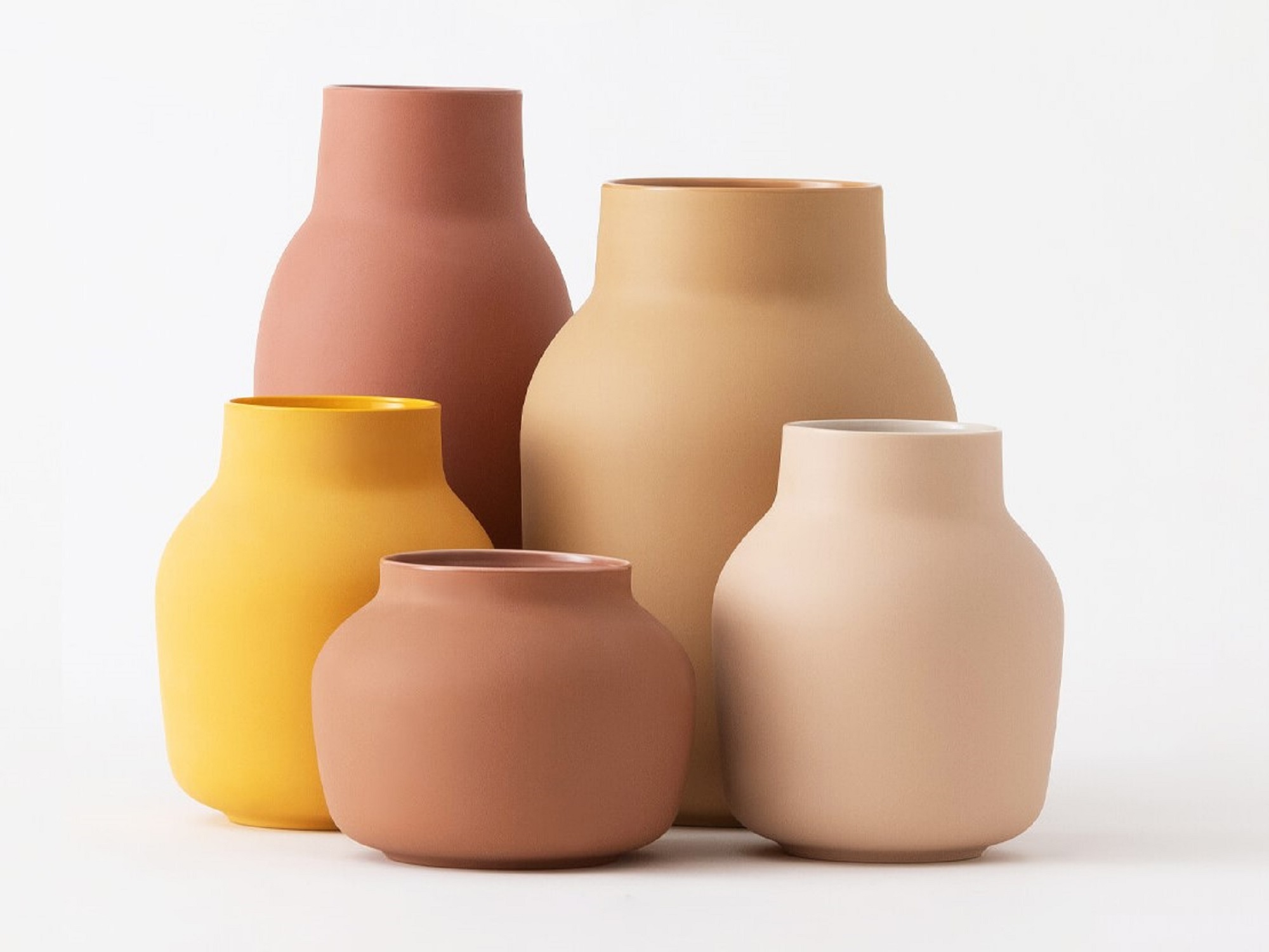 Front view of five earth tone ceramic flower vases