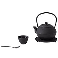 Front view of cast iron tea set