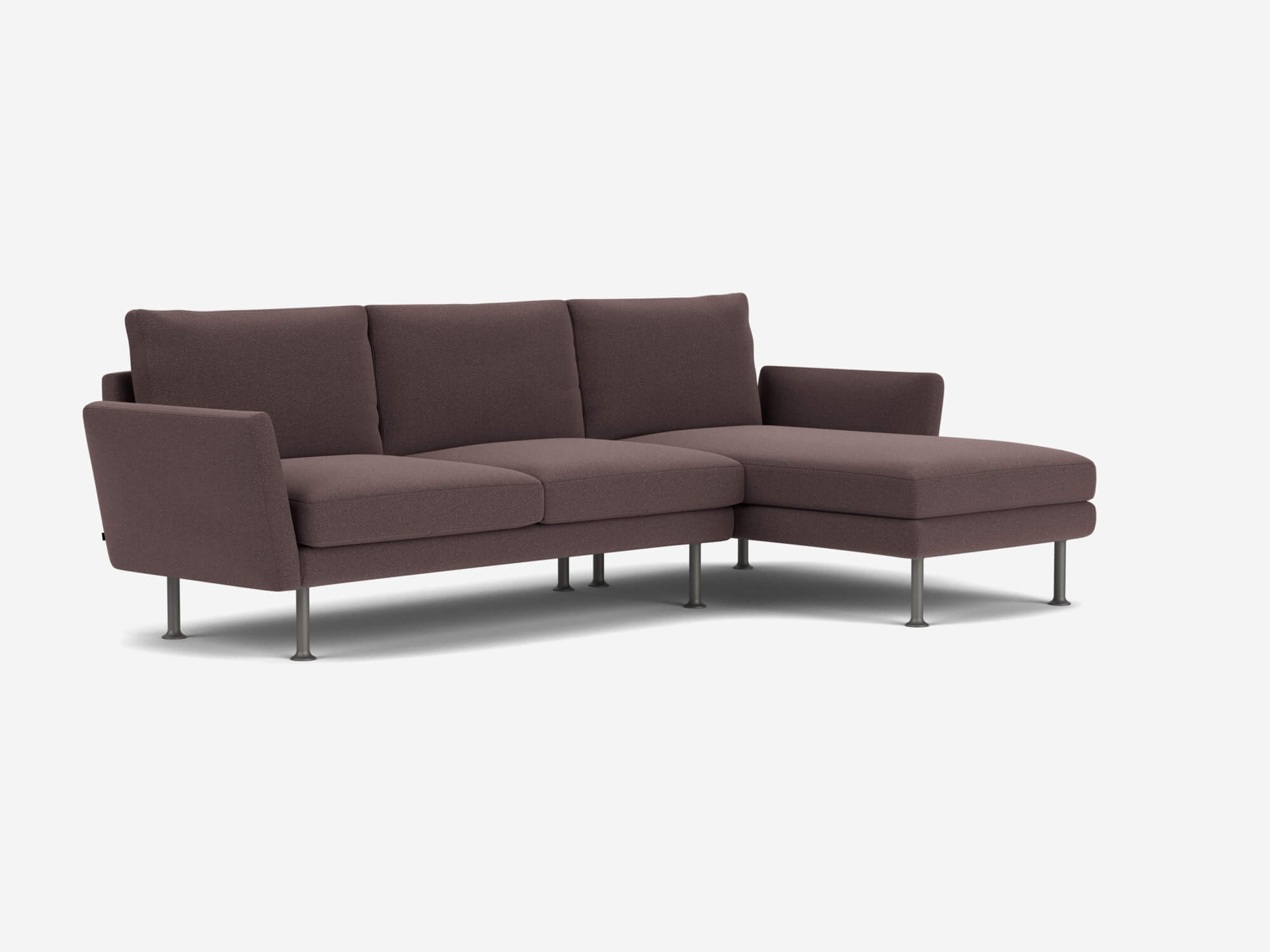 Front angle view of brown sectional sofa with low arms and right facing chaise