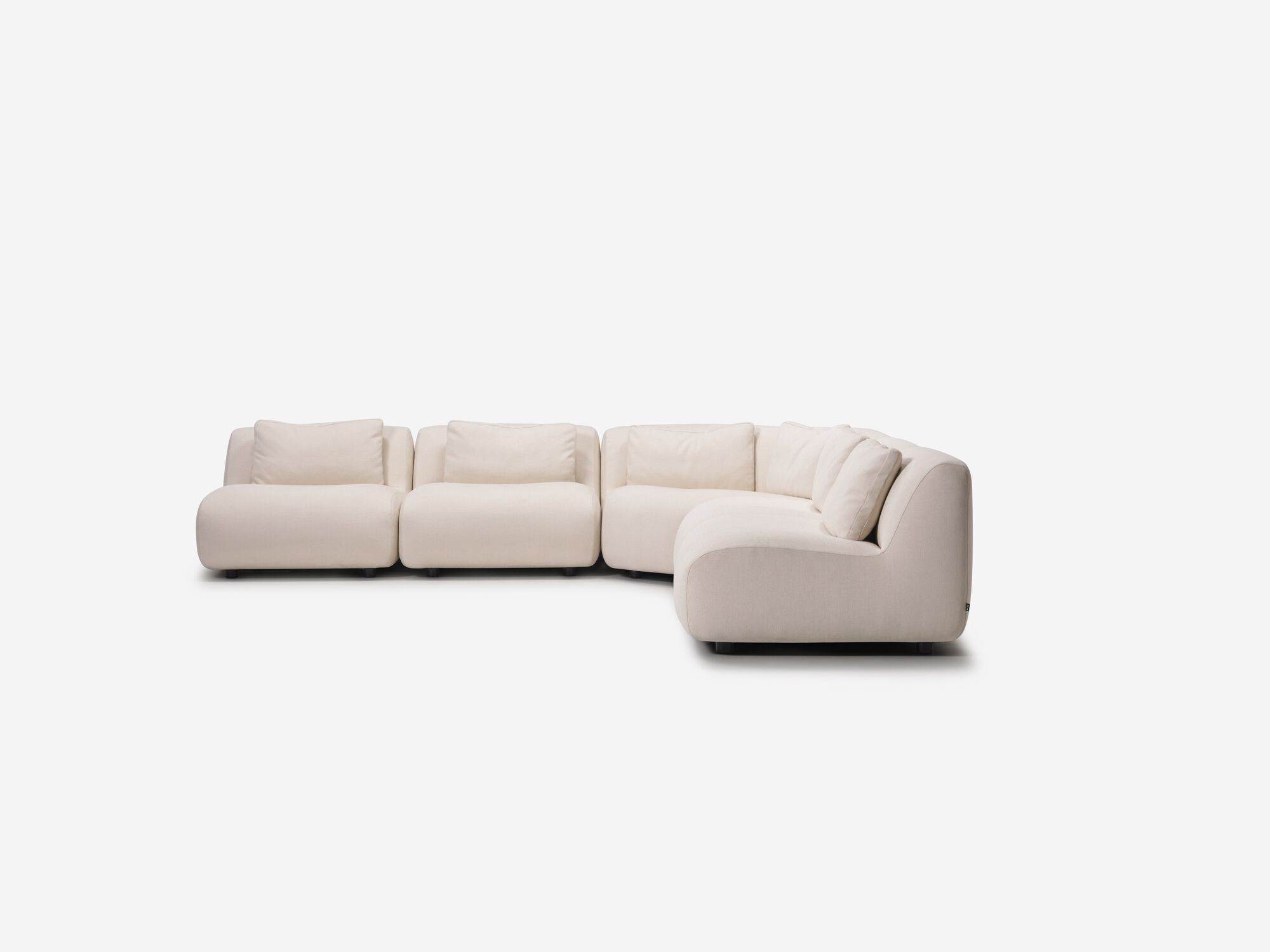 Angle view of beige curved sectional