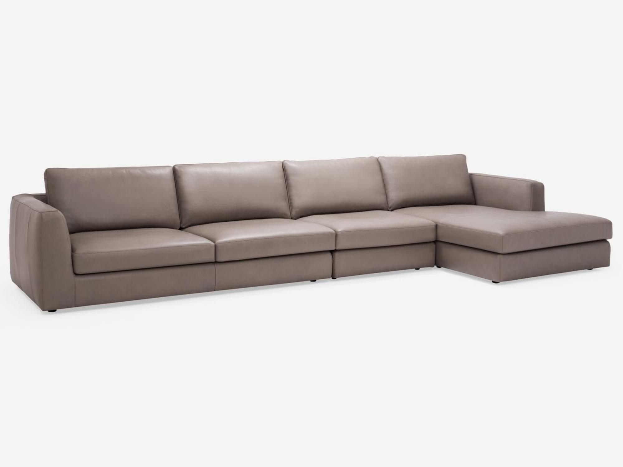 Corner view of the Cello modular sofa in beige leather with right hand chaise