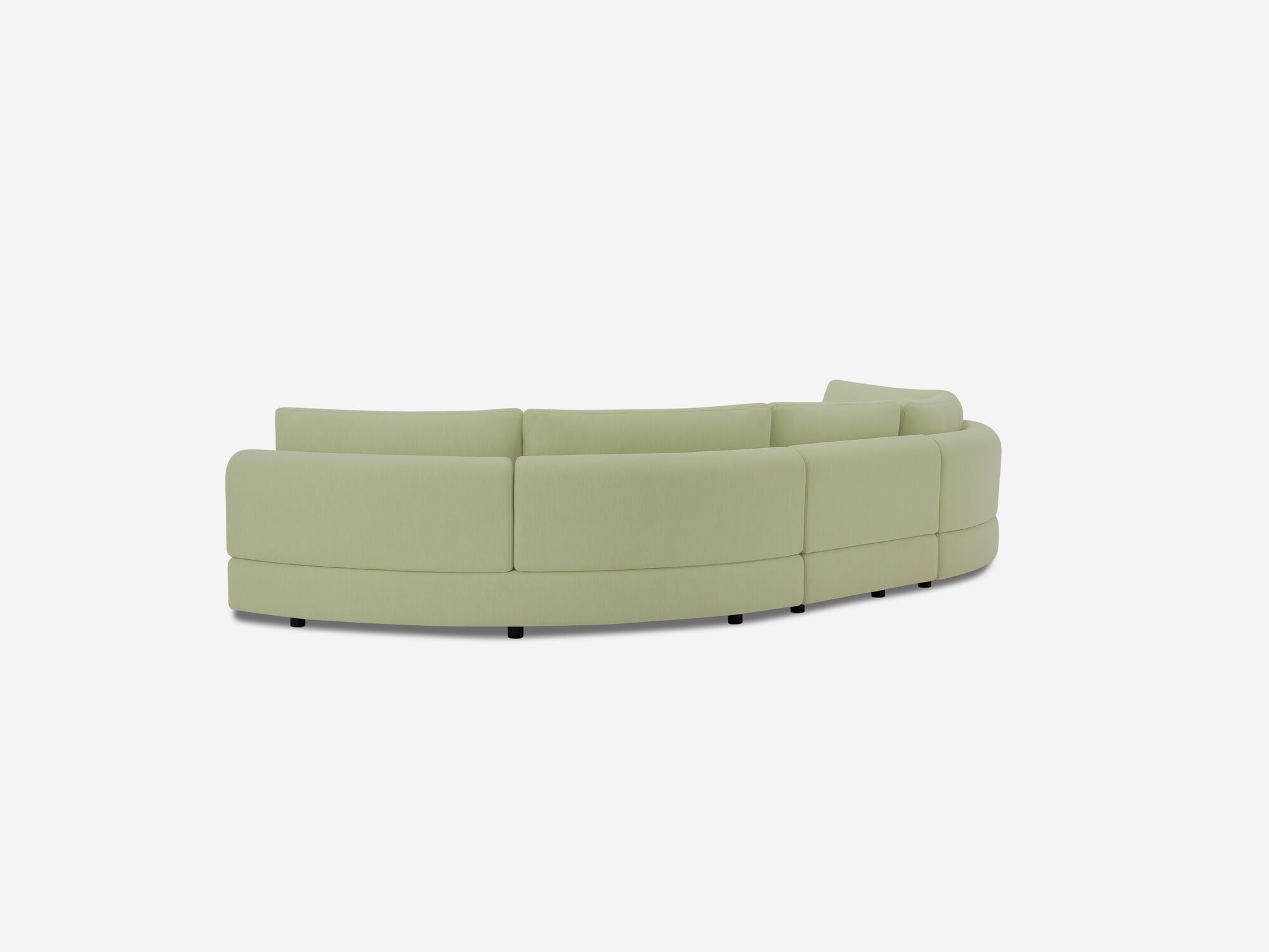 Back angle view of light green curved sectional sofa