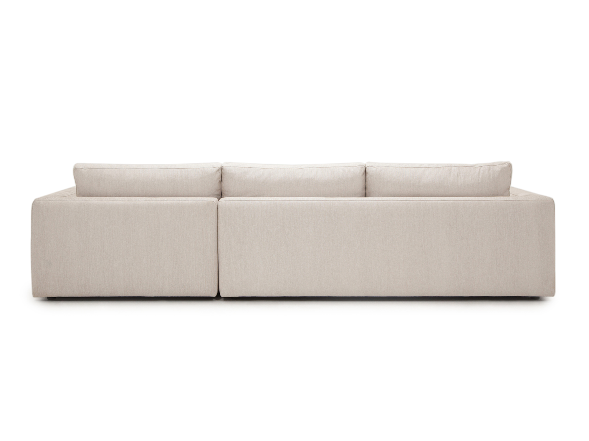 Back view of  the sectional sofa in a white fabric