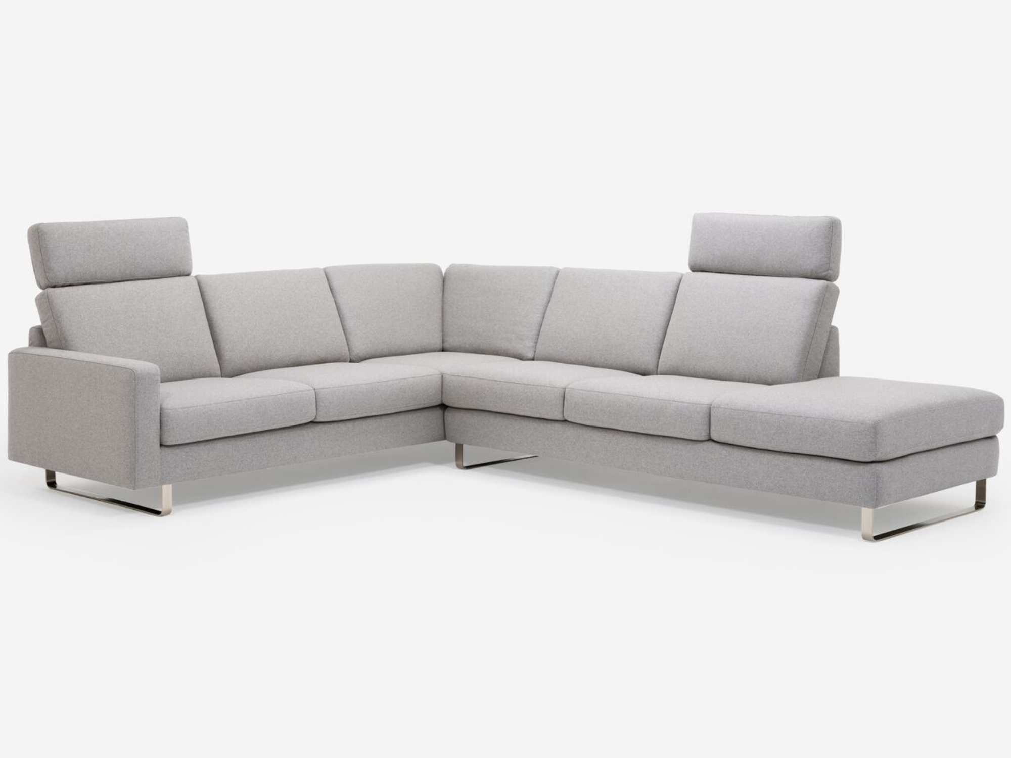 Front angled detail view of grey 2-piece sectional sofa with headrests